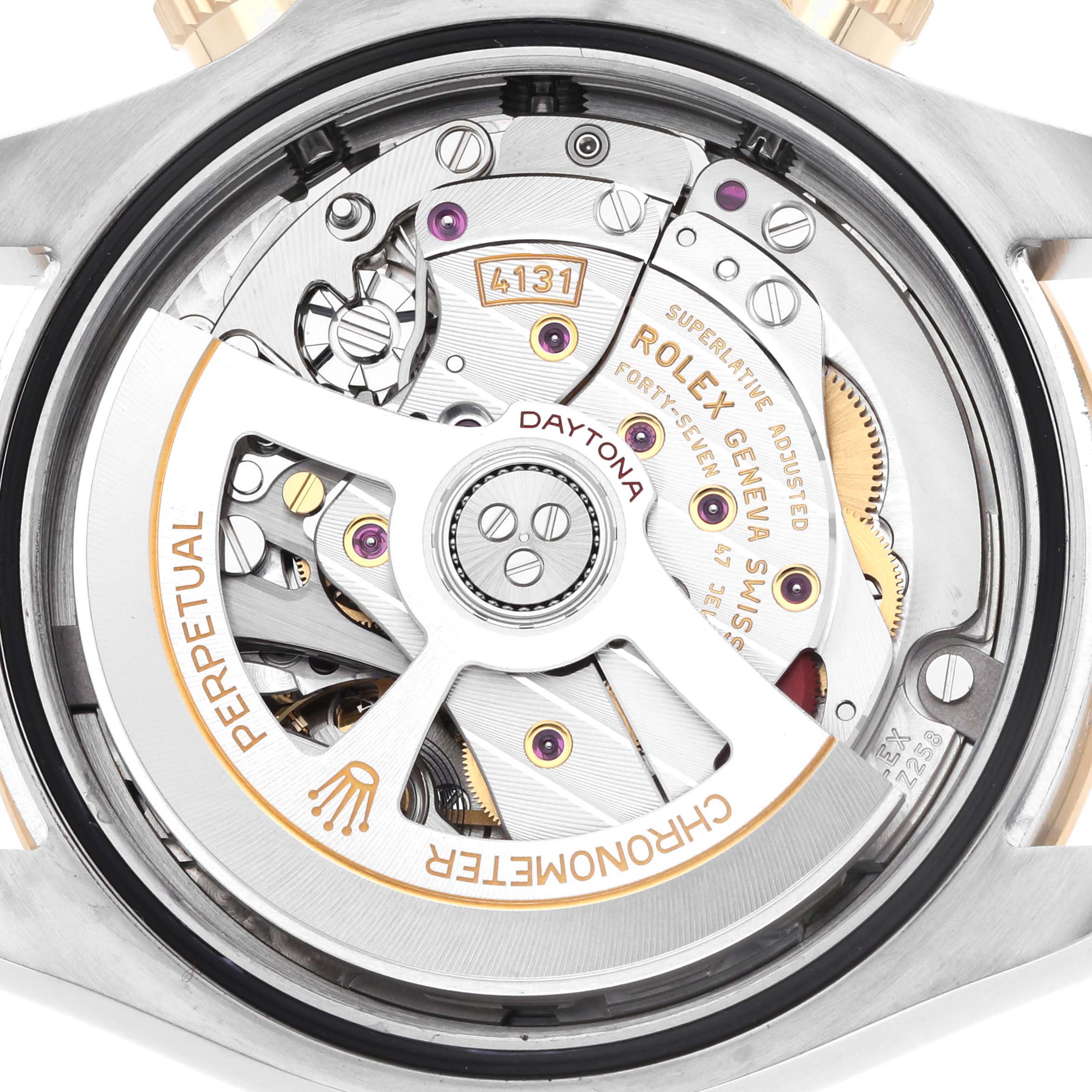 The image shows the back view of a Rolex Daytona 126503 Men
s Steel and Gold (two tone) Black Dial watch, highlighting the movement and internal mechanisms.