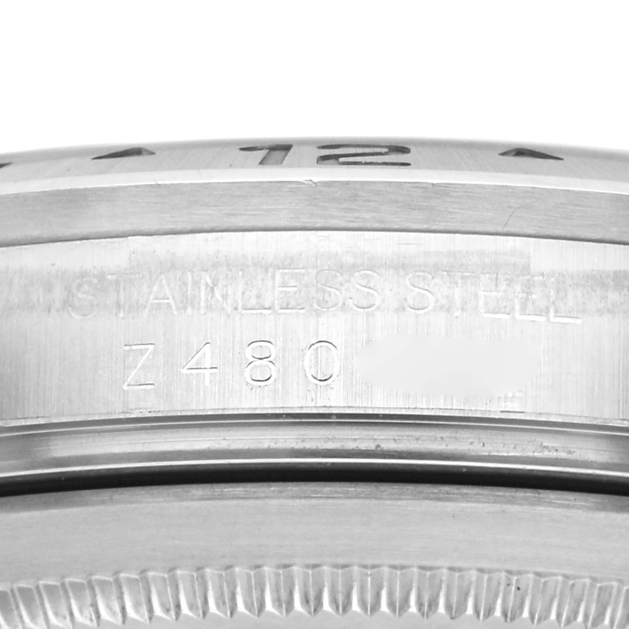 The image shows the side engraving of the bezel and case back of the Rolex Explorer 16570 Men
s Stainless Steel Black Dial.