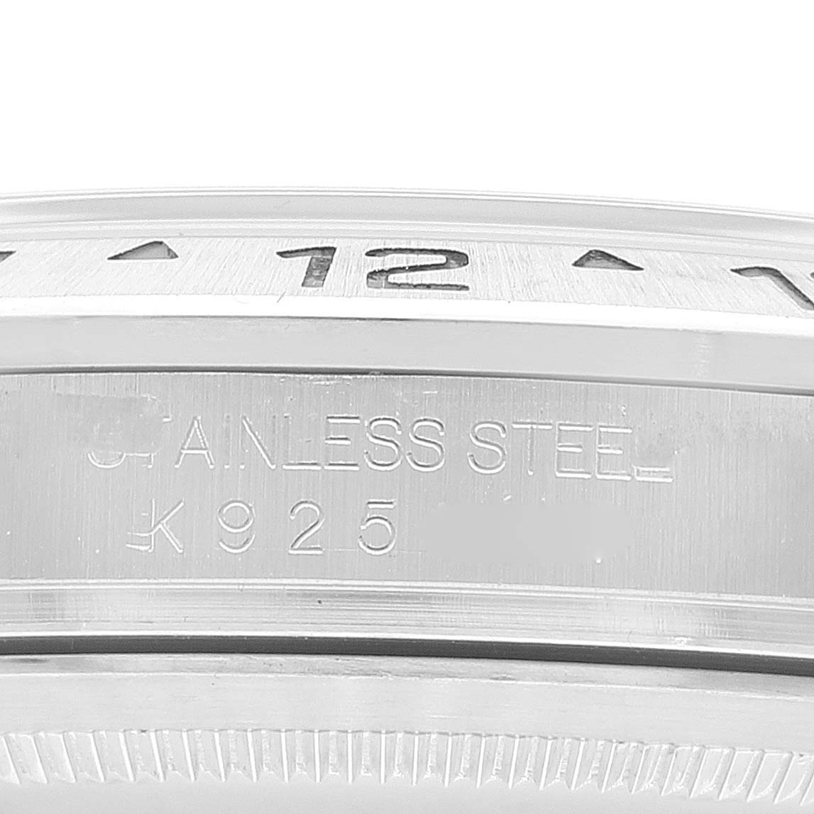 The image shows a close-up of the bezel and case side of a Rolex Explorer 16570 Men's Stainless Steel White Dial 16570 Men's Stainless Steel White Dial watch, with part of the engraved model information visible.