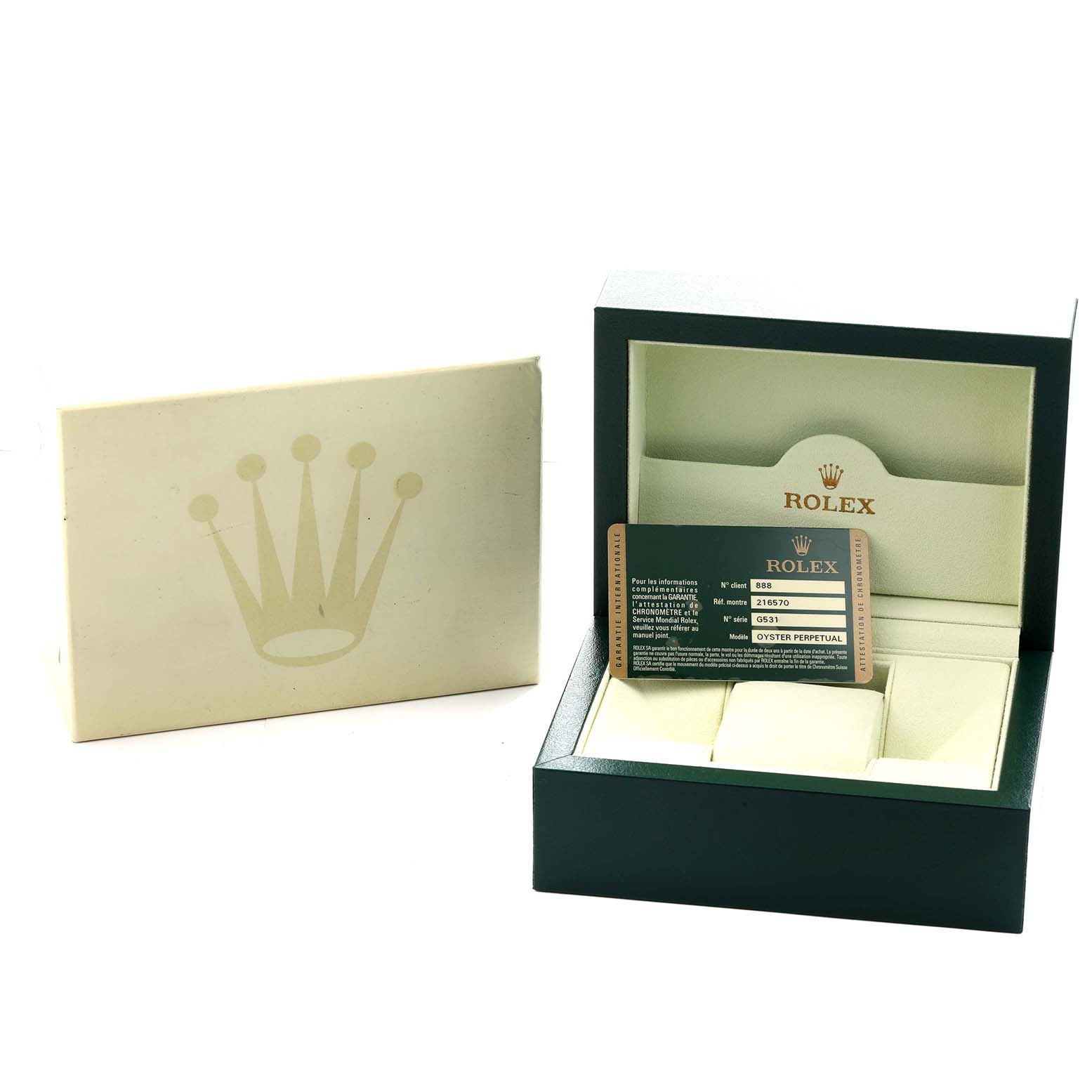 The image shows the packaging and a warranty card for a Rolex Explorer 216570 Men's Stainless Steel Black Dial watch, with an open box and card visible.