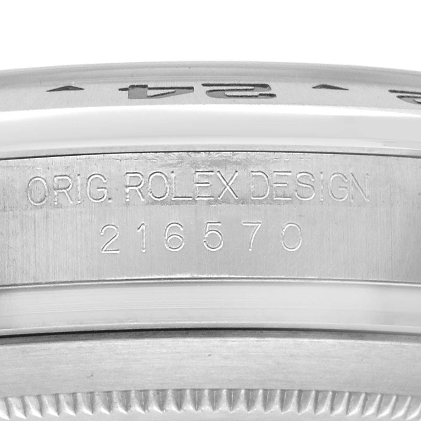 The image shows a close-up side view of the bezel and case edge of a Rolex Explorer 216570 Men's Stainless Steel Black Dial, focusing on the engraved model number.