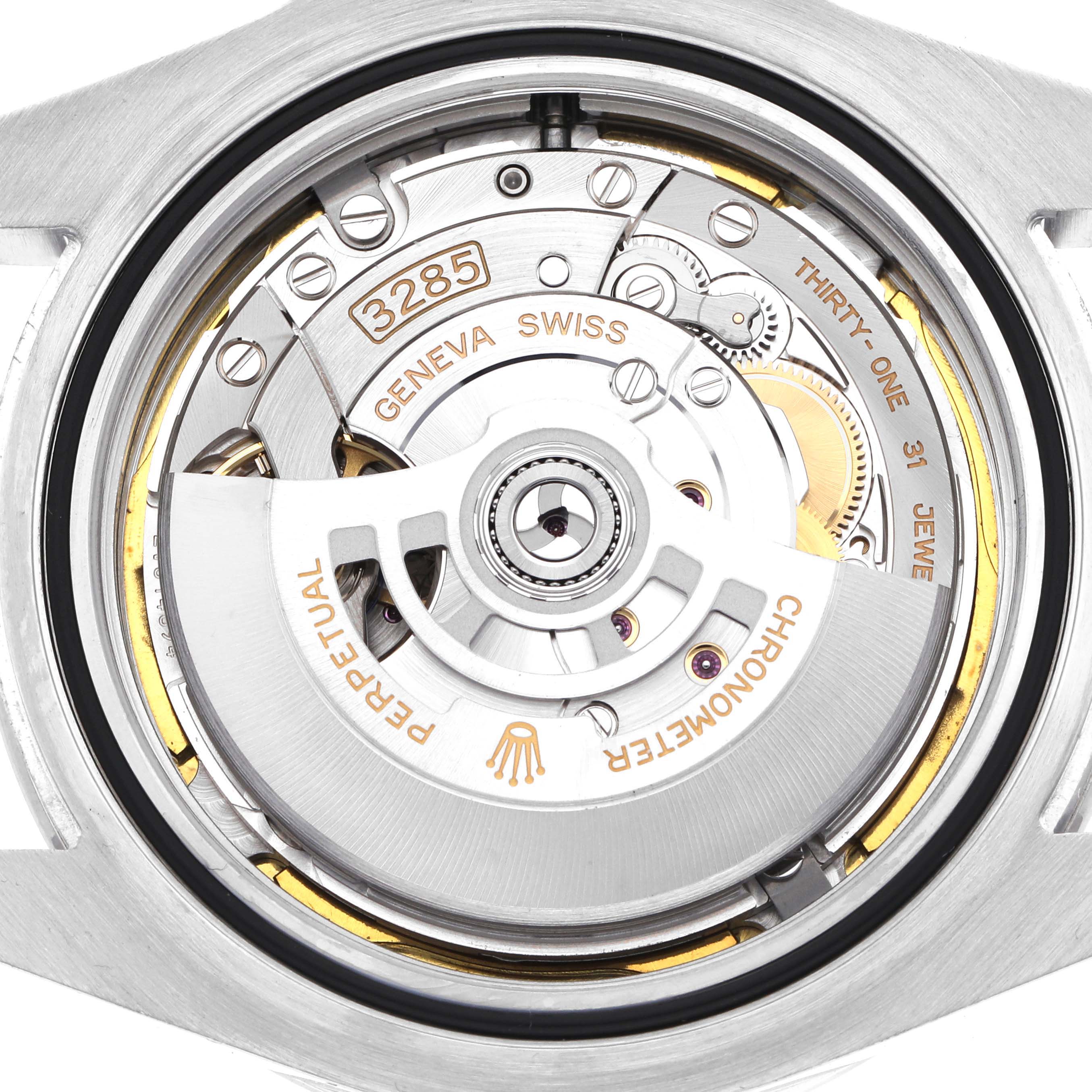 The image shows the rear view of the Rolex Explorer 226570 Men
s Stainless Steel White Dial watch, focusing on its movement.