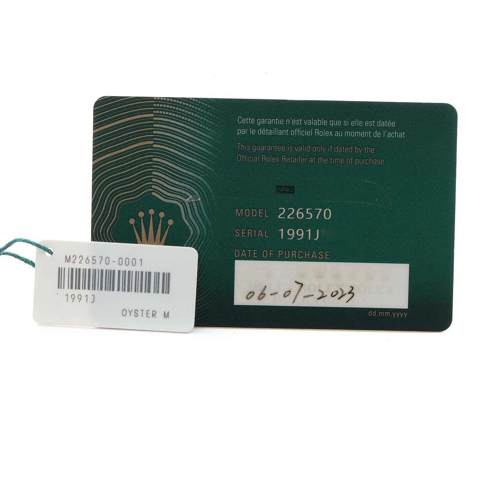 The image shows a Rolex Explorer 226570 Men
s Stainless Steel White Dial model 226570 warranty card and a tag with serial number information.