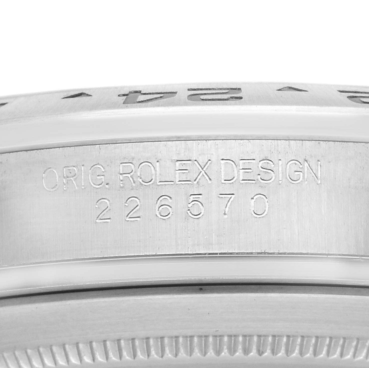 The image shows the side view of a Rolex Explorer 226570 Men
s Stainless Steel White Dial watch, highlighting the engraved model number and bezel.