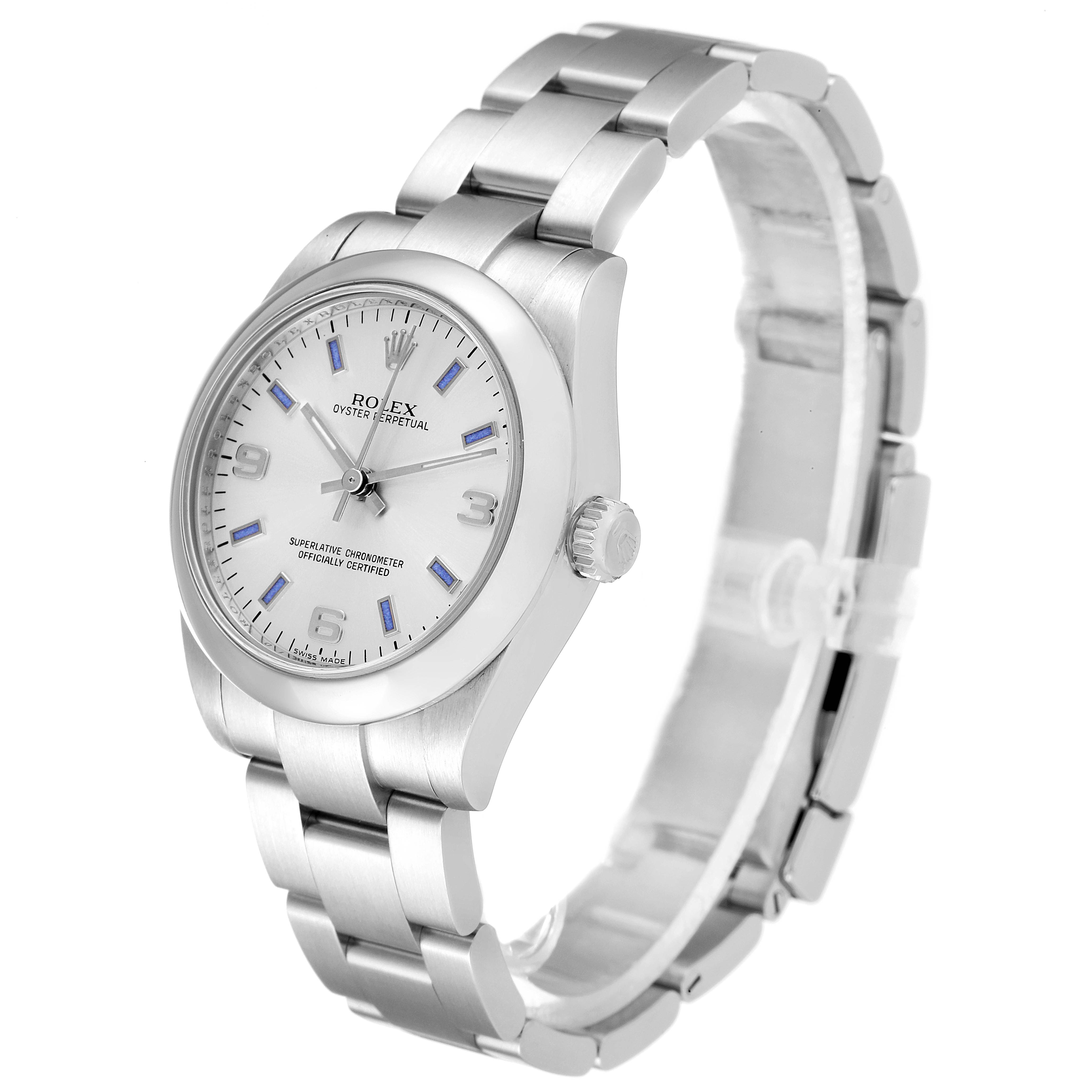 The image shows a side view of a Mid-Size Rolex Oyster Perpetual watch, focusing on the dial, crown, and bracelet.