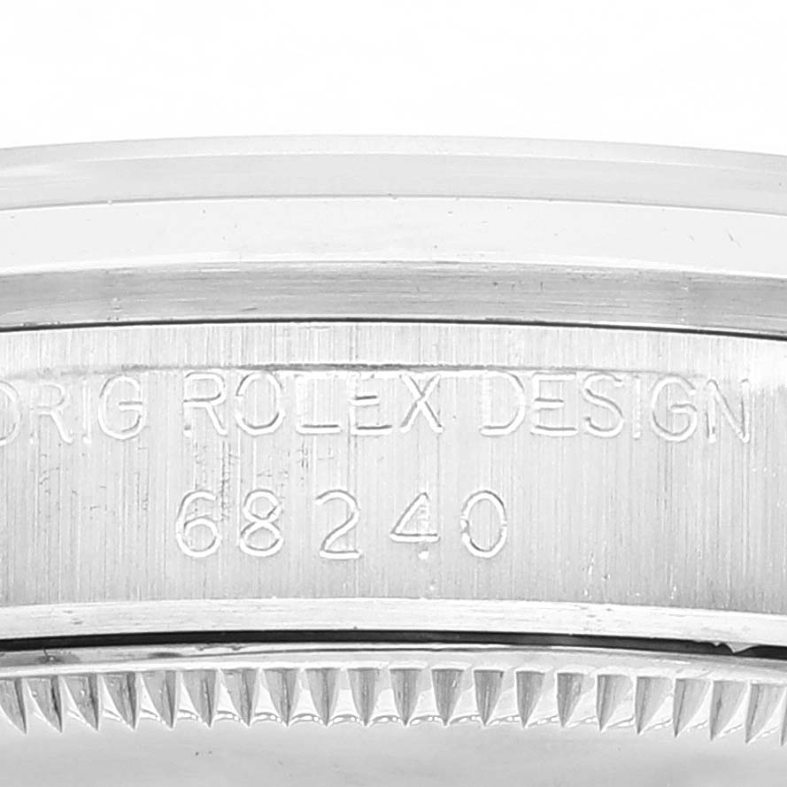 This image shows a close-up of the case's side with model number and engraving on a Rolex Mid-Size 68240 Women's Stainless Steel White Dial 68240 Women's Stainless Steel White Dial watch.