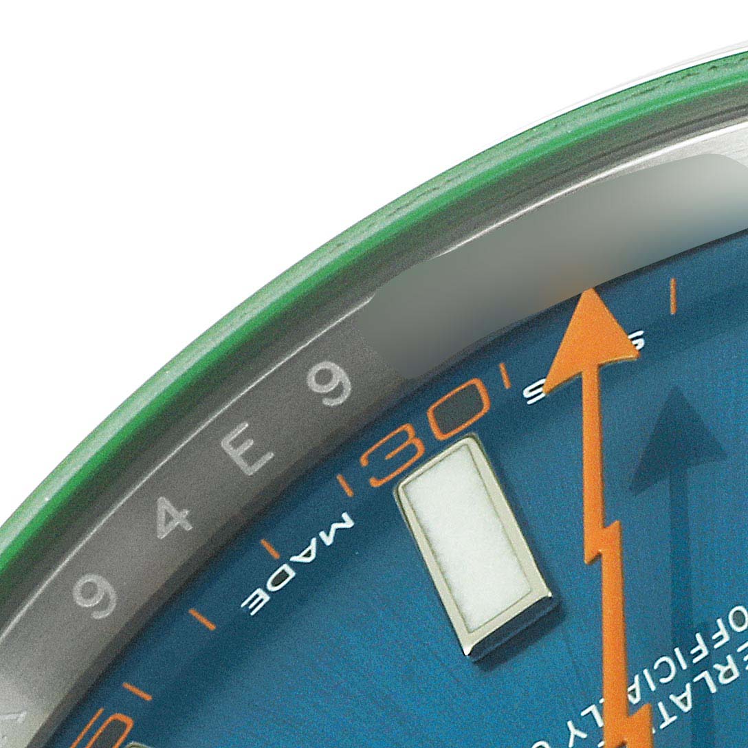 The image shows a close-up of the Rolex Milgauss 116400GV Men
s Stainless Steel Blue Dial 116400GV Men
s Stainless Steel Blue Dial watch face, focusing on the hour markers, and second hand.