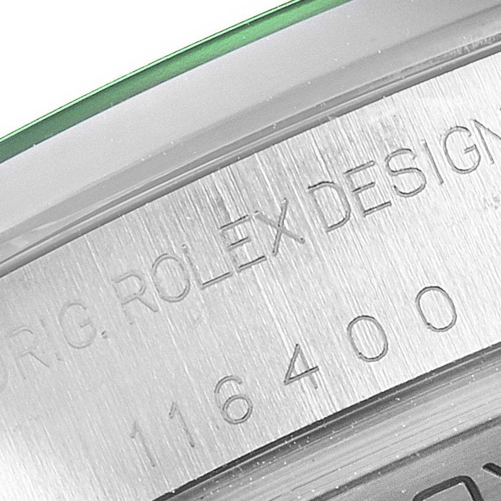 The image shows a close-up angle of the inner bezel with engraved details from a Rolex Milgauss 116400GV Men
s Stainless Steel Blue Dial 116400GV Men
s Stainless Steel Blue Dial watch.