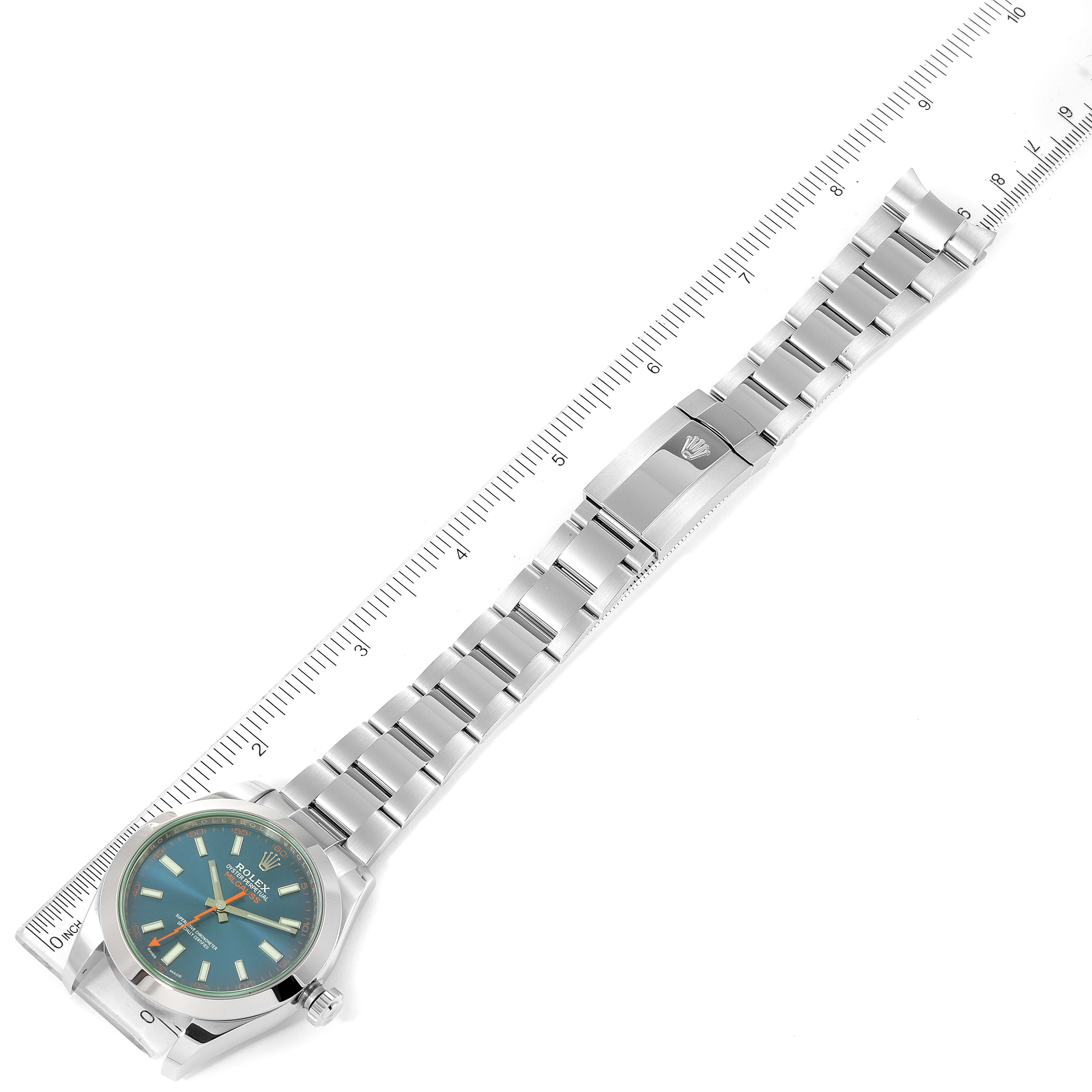 The Rolex Milgauss 116400GV Men
s Stainless Steel Blue Dial 116400GV Men
s Stainless Steel Blue Dial watch is shown in a top-down angle, displaying its full bracelet and face alongside a measuring ruler.