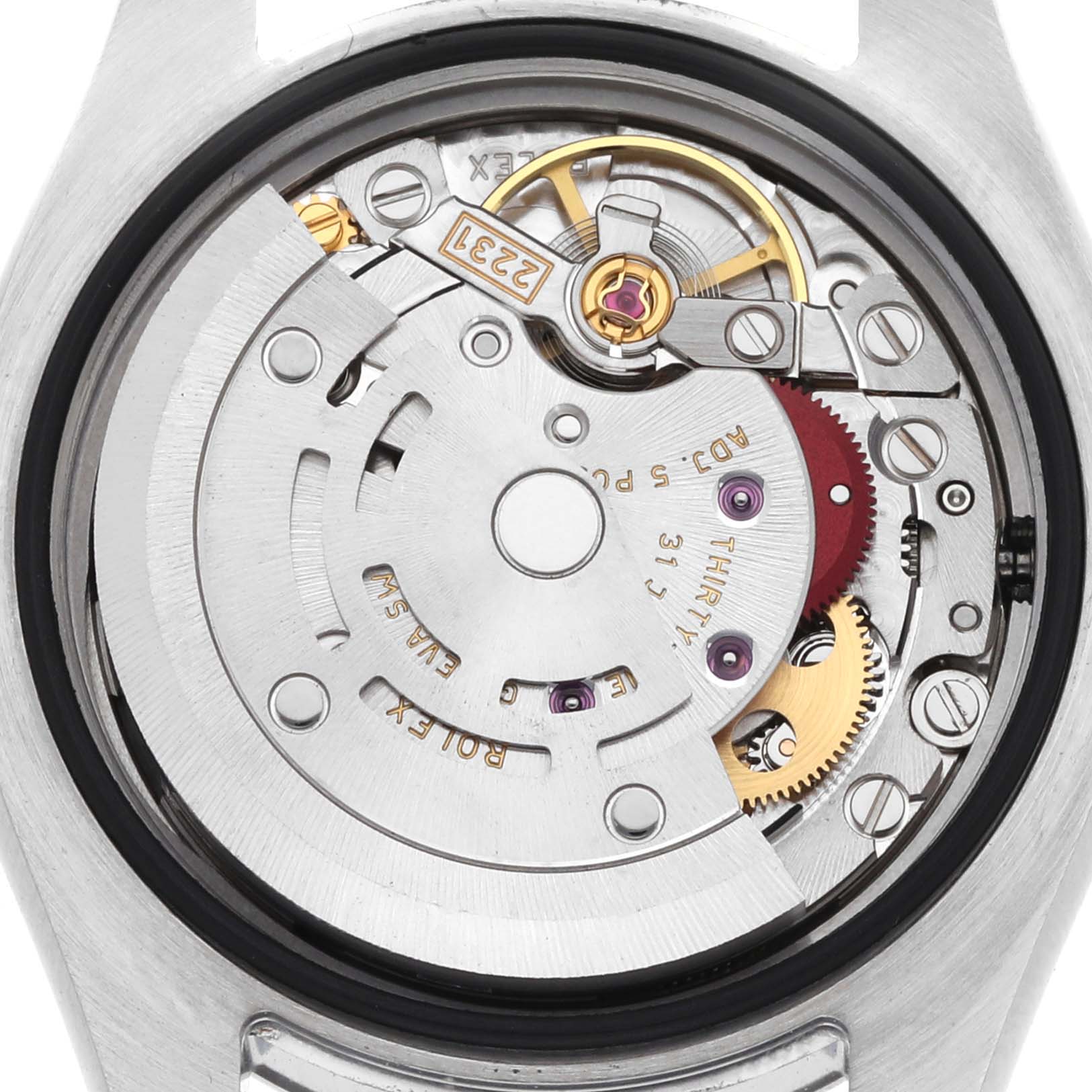 This image shows the movement mechanism of a Rolex Oyster Perpetual 176200 Women
s Stainless Steel Black Dial watch, viewed from the back.