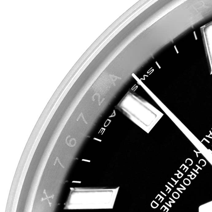 The image shows a close-up of the dial and part of the bezel of the Rolex Oyster Perpetual 176200 Women
s Stainless Steel Black Dial watch.