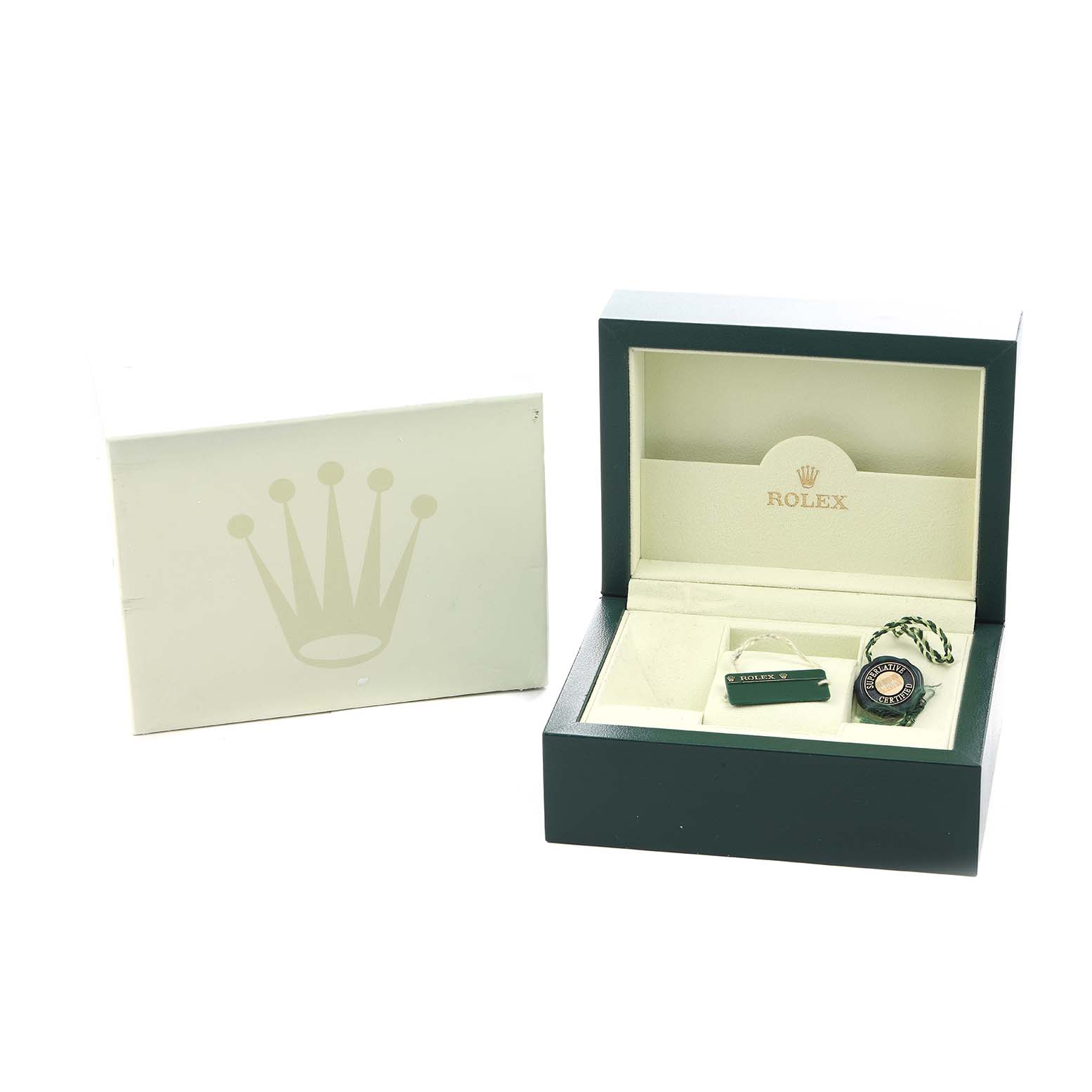The image shows the packaging for a Rolex Oyster Perpetual 114200 Men's Stainless Steel White Dial, including the open box with tags and manual at an elevated angle.