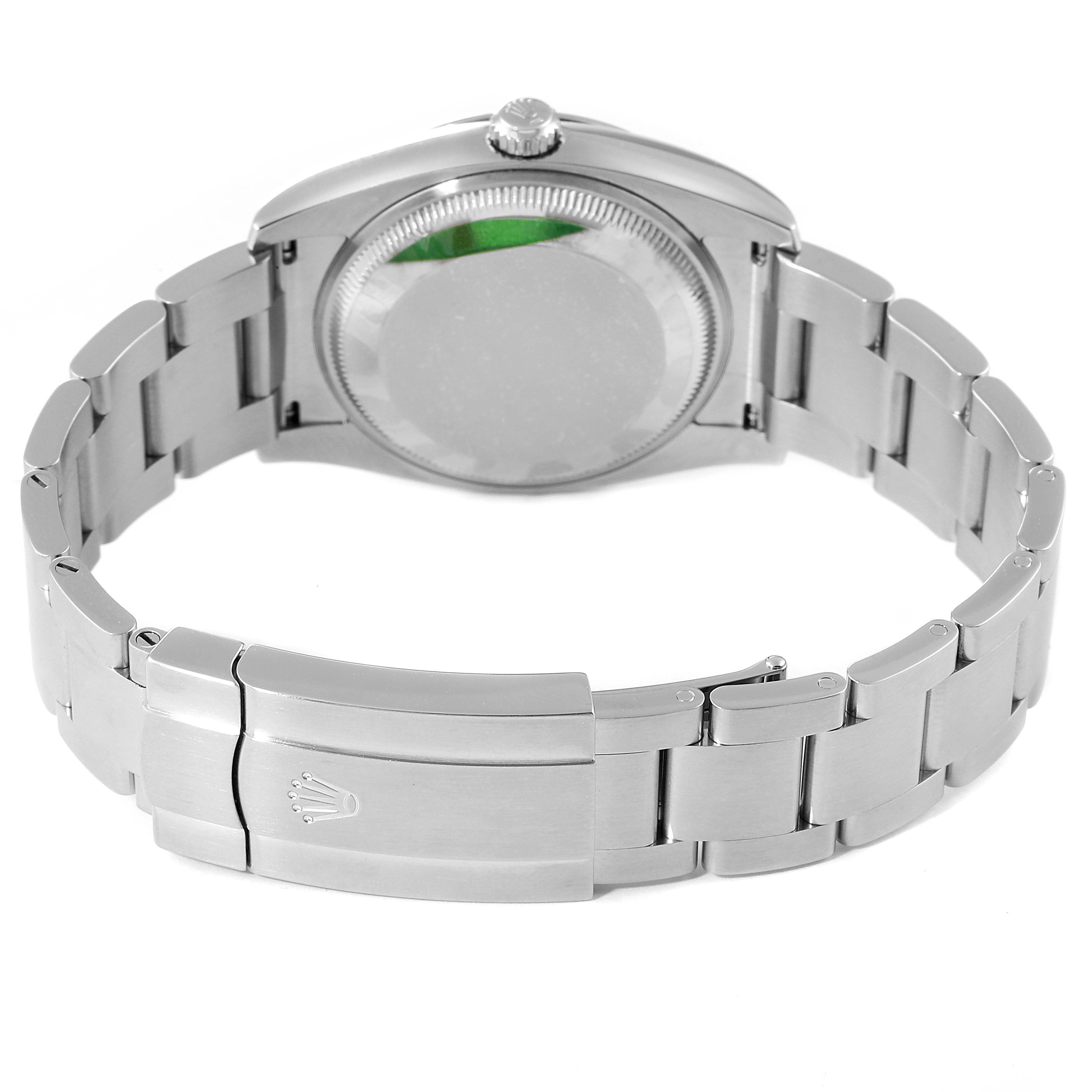 This image shows the back of the Rolex Oyster Perpetual 114200 Men's Stainless Steel Champagne Dial 114200 Men's Stainless Steel Champagne Dial watch, focusing on its case, crown, and bracelet.