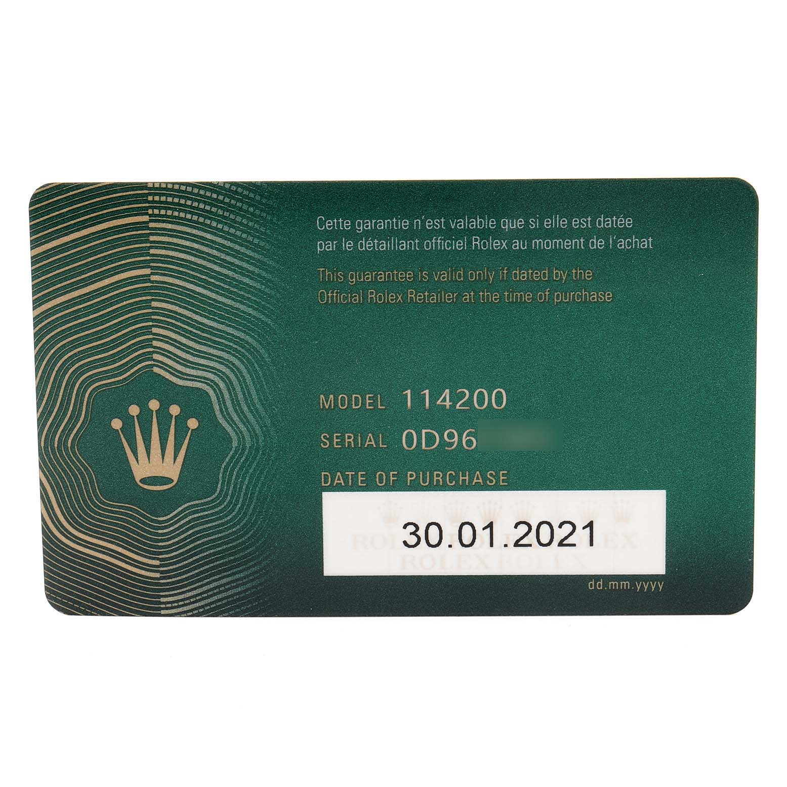 This image shows the warranty card for the Rolex Oyster Perpetual 114200 Men's Stainless Steel Champagne Dial 114200 Men's Stainless Steel Champagne Dial model 114200, displaying the model number, serial number, and date of purchase.