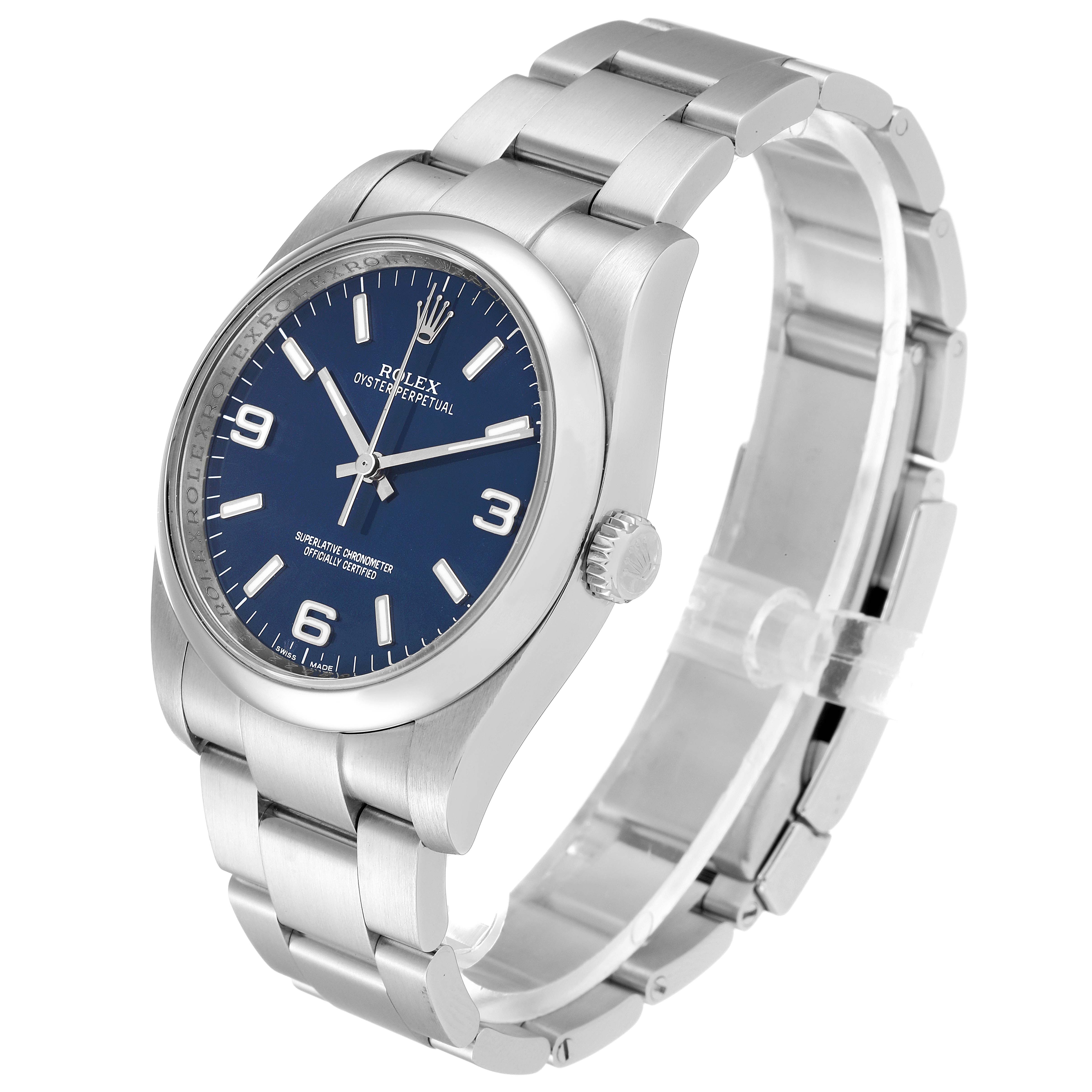 This Rolex Oyster Perpetual 116000 Men
s Stainless Steel Blue Dial 116000 Men
s Stainless Steel Blue Dial watch is shown at an angle highlighting the dial, crown, and bracelet.