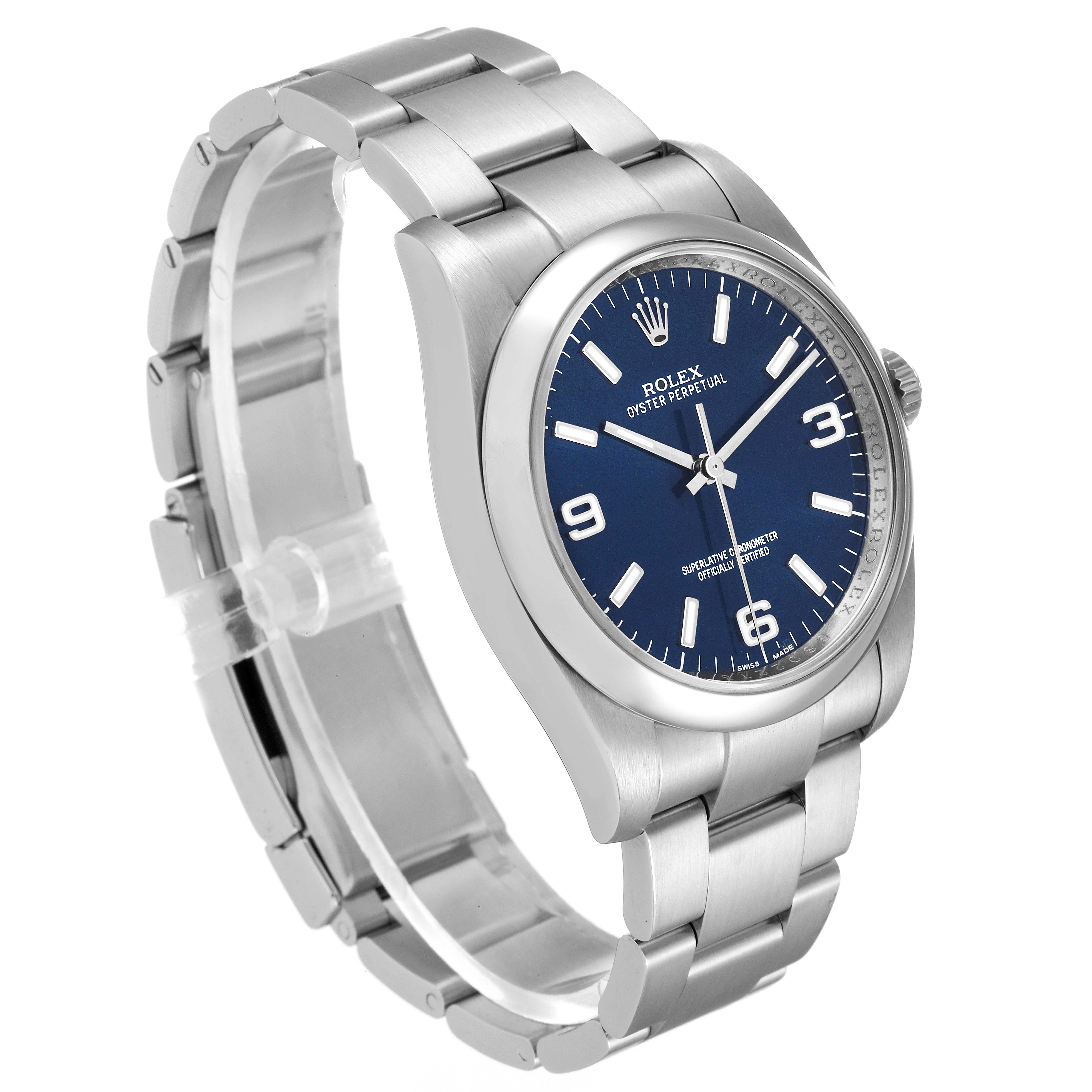 The Rolex Oyster Perpetual 116000 Men
s Stainless Steel Blue Dial 116000 Men
s Stainless Steel Blue Dial watch is shown at a three-quarter angle highlighting the face, bezel, and bracelet.