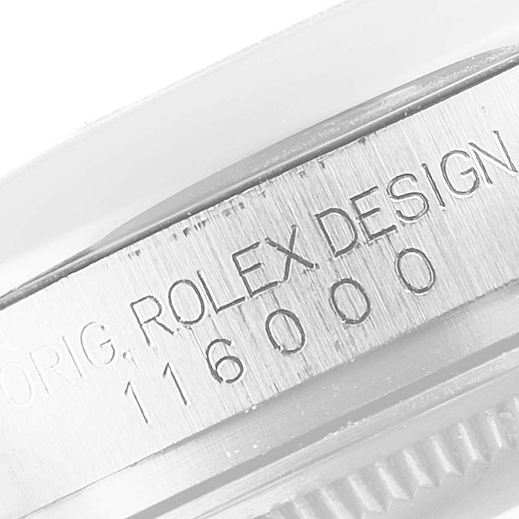 This close-up shows the side engraving of an Oyster Perpetual model by Rolex, detailing the model number 116000.