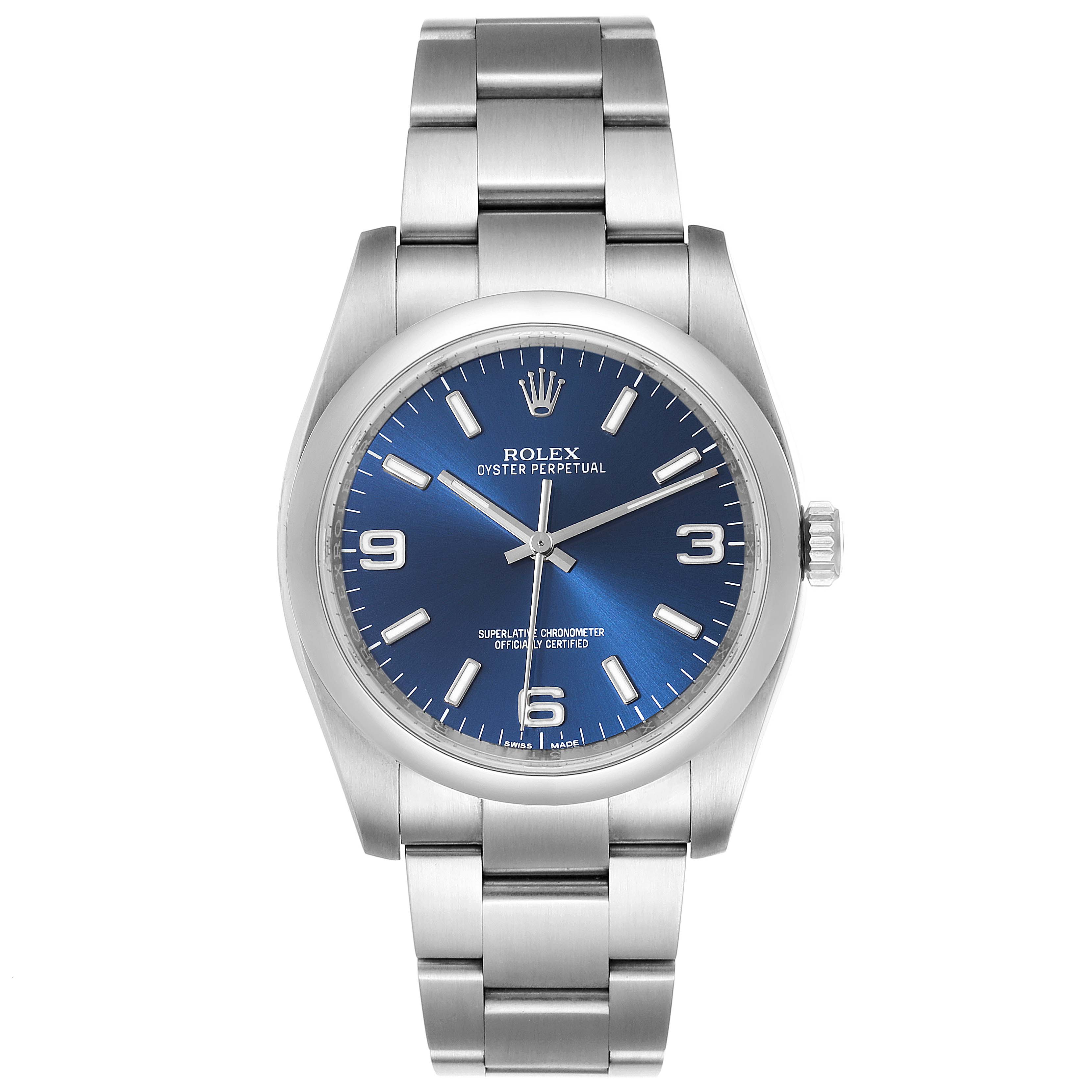 The image shows a front view of a Rolex Oyster Perpetual 116000 Men
s Stainless Steel Blue Dial 116000 Men
s Stainless Steel Blue Dial watch highlighting its blue dial and stainless steel bracelet.