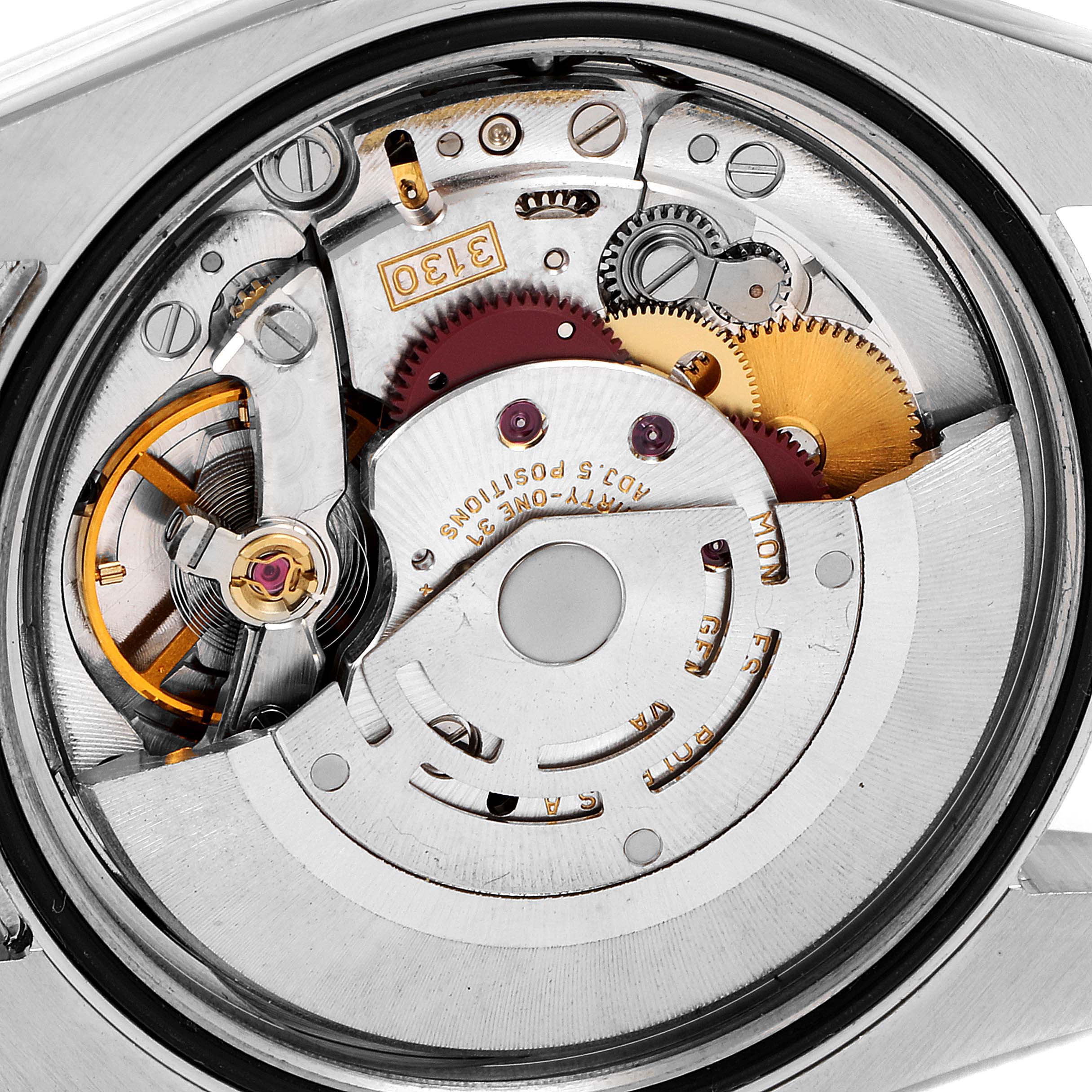 This image shows the internal mechanism and movement of a Rolex Oyster Perpetual 116000 Men
s Stainless Steel Blue Dial 116000 Men
s Stainless Steel Blue Dial watch from a top-down view.