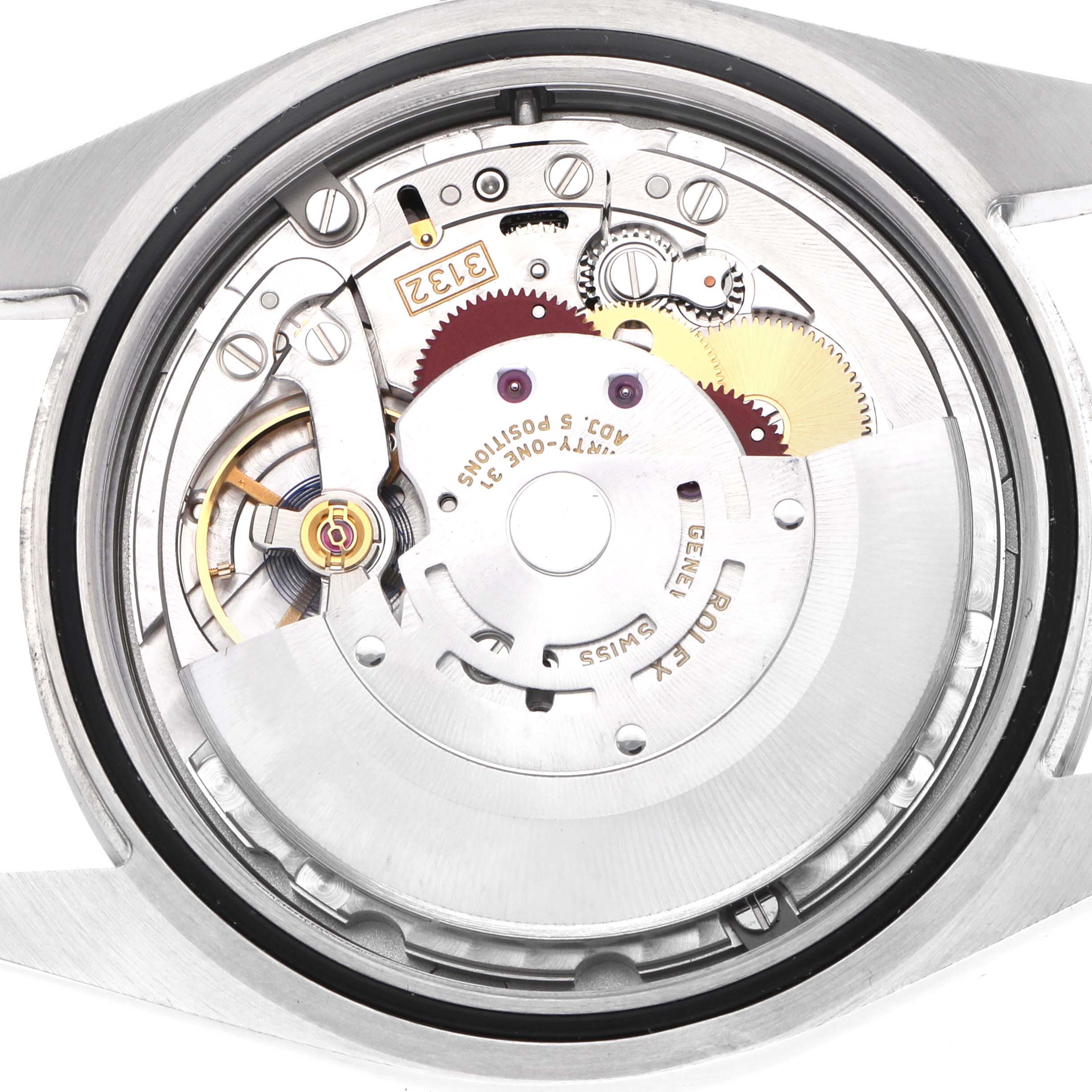 The image shows the movement mechanism of a Rolex Oyster Perpetual 114300 Men's Stainless Steel Grey Dial watch from a top-down angle.