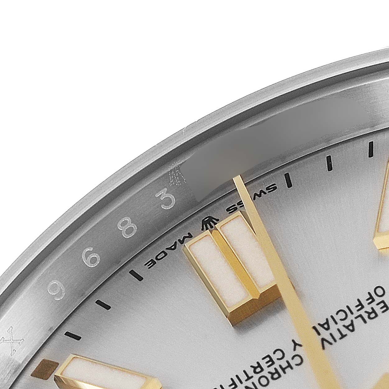 This close-up angle shows part of the dial and markers of a Rolex Oyster Perpetual 124300 Men's Stainless Steel Silver Dial 124300 Men's Stainless Steel Silver Dial watch.