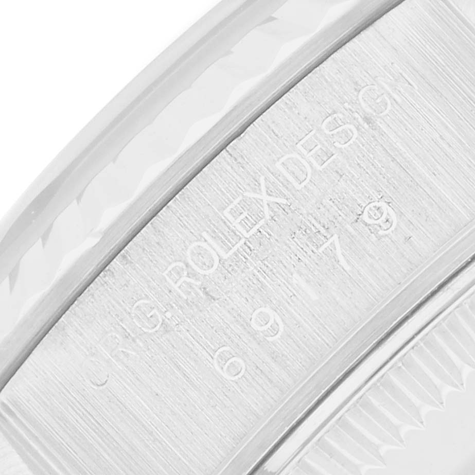 This image shows a close-up of the inner bezel with engraved details of the Rolex President 69179 Women
s White Gold Silver Dial model.