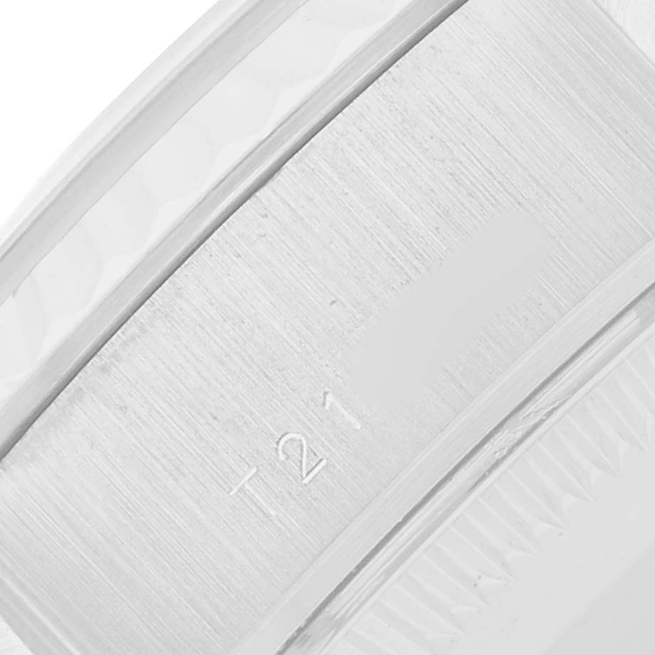 The image shows a close-up of the inner band of a Rolex President 69179 Women
s White Gold Silver Dial model, highlighting the brushed metal texture.