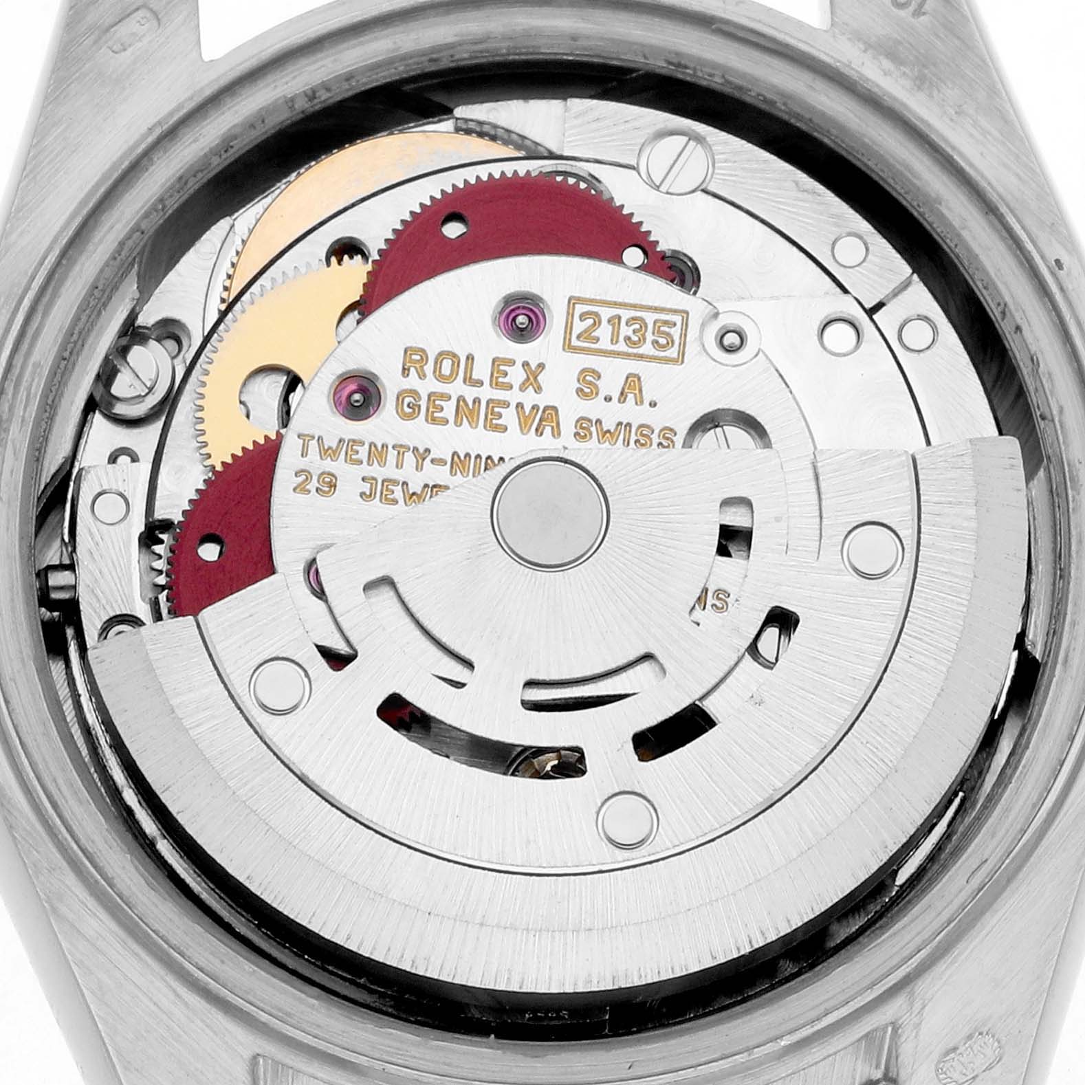 The image shows the movement of a Rolex President 69179 Women
s White Gold Silver Dial watch viewed from the back, highlighting gears and the rotor.