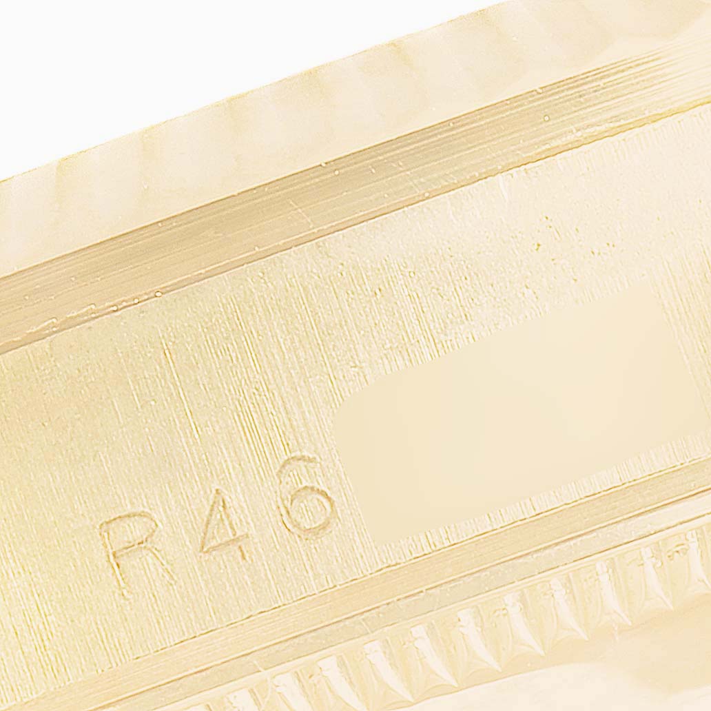This image shows a close-up of the case side with engravings of a Rolex President 68278 Women's Yellow Gold Champagne Dial 68278 Women's Yellow Gold Champagne Dial model watch.