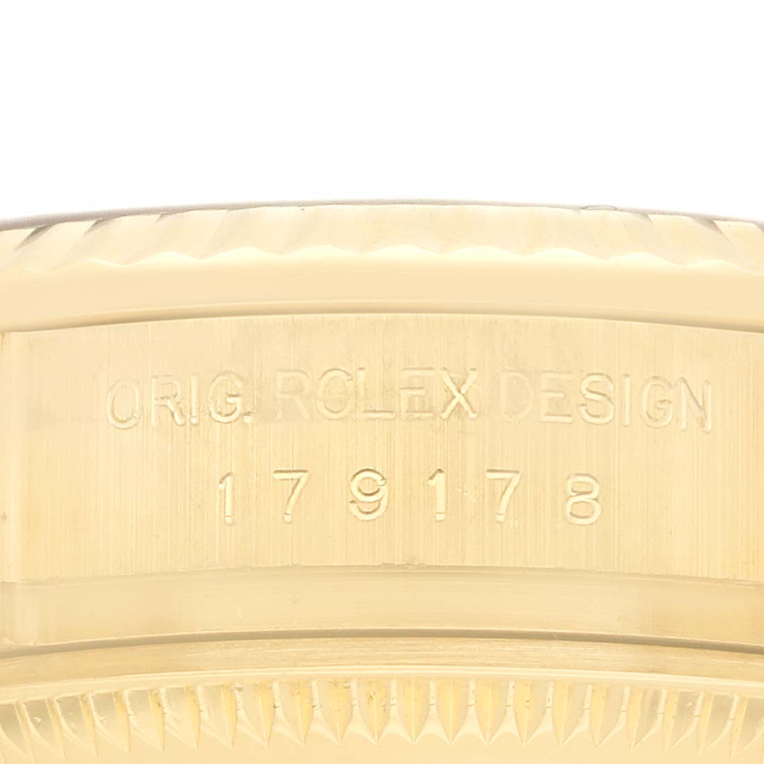 The image shows the side engraving of a Rolex President 179178 Women
s Yellow Gold Champagne Dial model, highlighting the model number and "ORIG. ROLEX DESIGN" on the case.