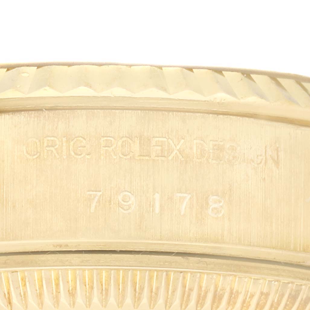 The image shows a close-up of the bezel and serial markings on a Rolex President 79178 Women's Yellow Gold Champagne Dial 79178 Women's Yellow Gold Champagne Dial model watch.