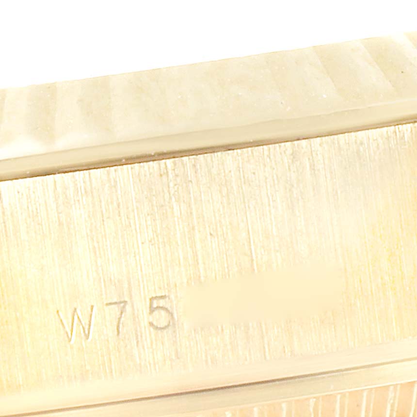 This close-up image shows the side of the case of a Rolex President 69178 Women's Yellow Gold Silver Dial 69178 Women's Yellow Gold Silver Dial watch, with a partial serial number visible.