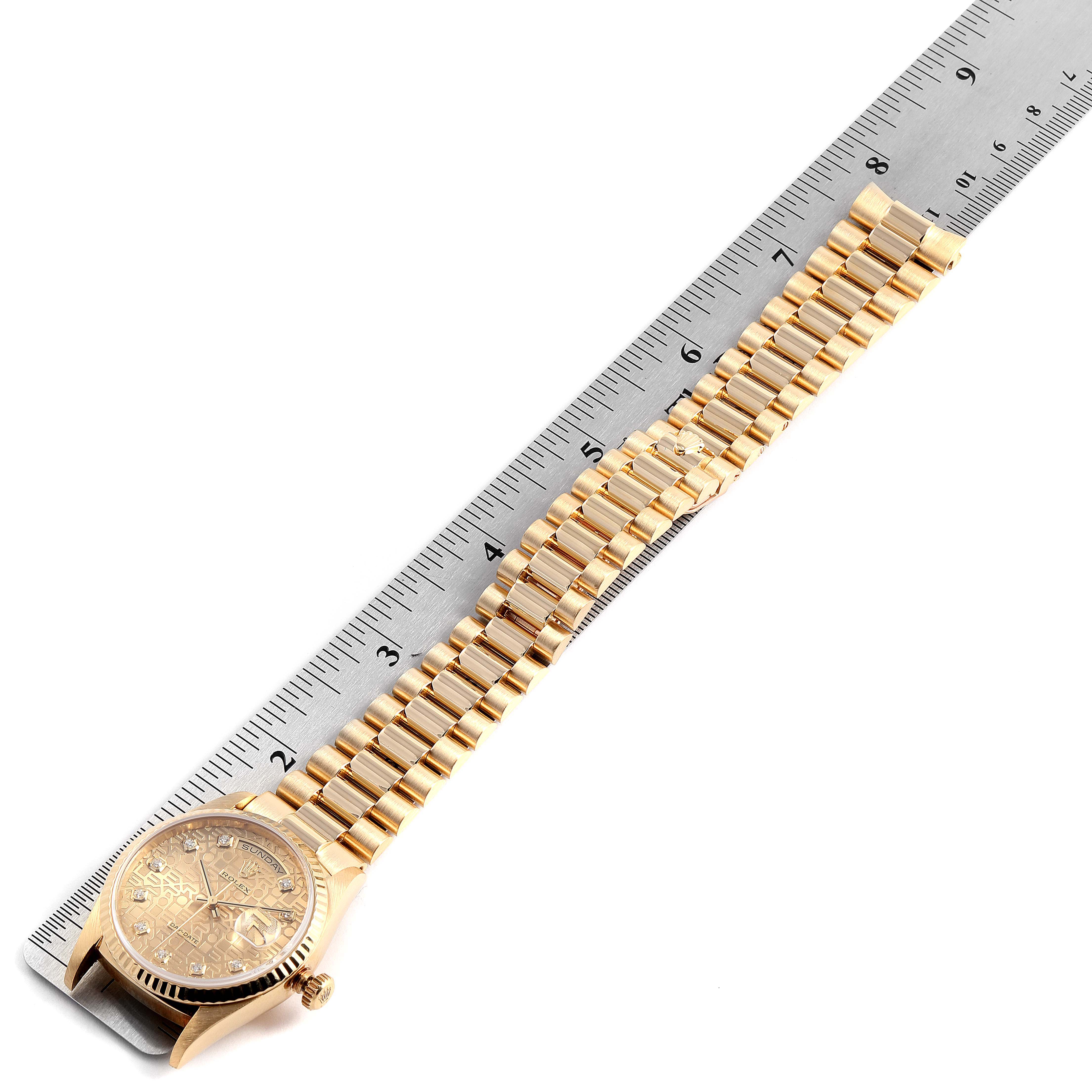 The image shows the Rolex President 18238 Men's Yellow Gold Champagne Dial 18238 Men's Yellow Gold Champagne Dial model watch angled flat, with its band extended alongside a ruler for measurement.