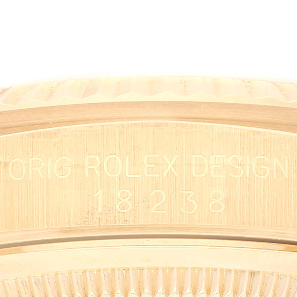 This close-up image shows the engraved model number on the side of the case of a Rolex President 18238 Men
s Yellow Gold Champagne Dial 18238 Men
s Yellow Gold Champagne Dial watch.