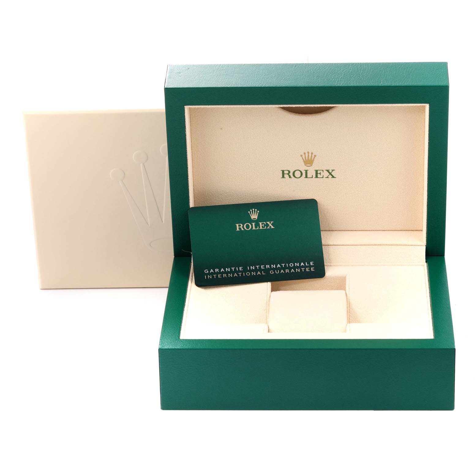 This image shows a green and beige Rolex watch box for the President model, along with the international guarantee card.