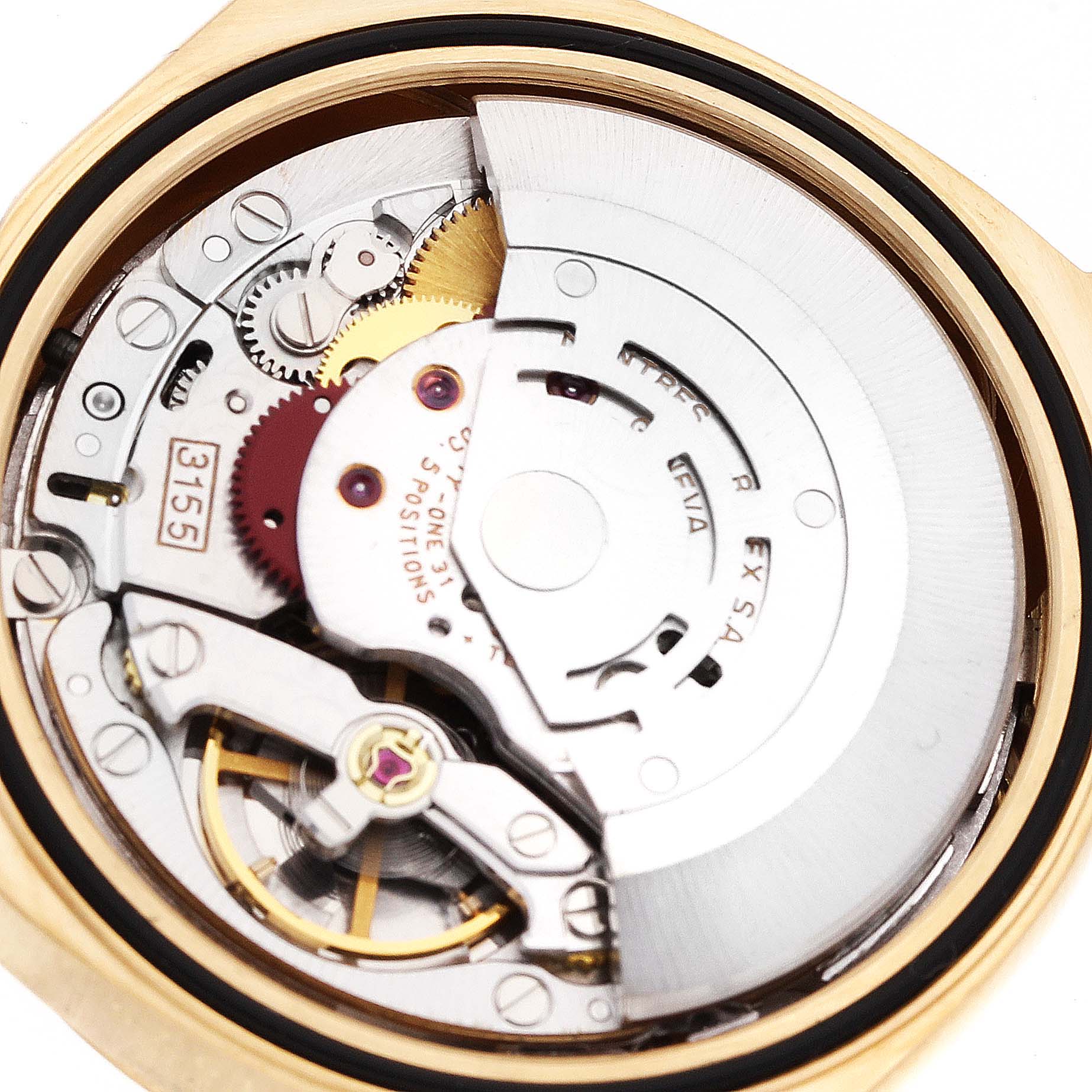 This image shows a close-up of the movement inside a Rolex President 18238 Men's Yellow Gold Champagne Dial 18238 Men's Yellow Gold Champagne Dial model watch, focusing on gears and mechanical parts.