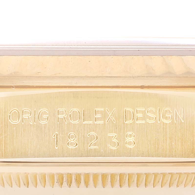 This image shows a close-up of the case side of the Rolex President 18238 Men's Yellow Gold Champagne Dial 18238 Men's Yellow Gold Champagne Dial model, highlighting the engraved "ORIG ROLEX DESIGN 18238."