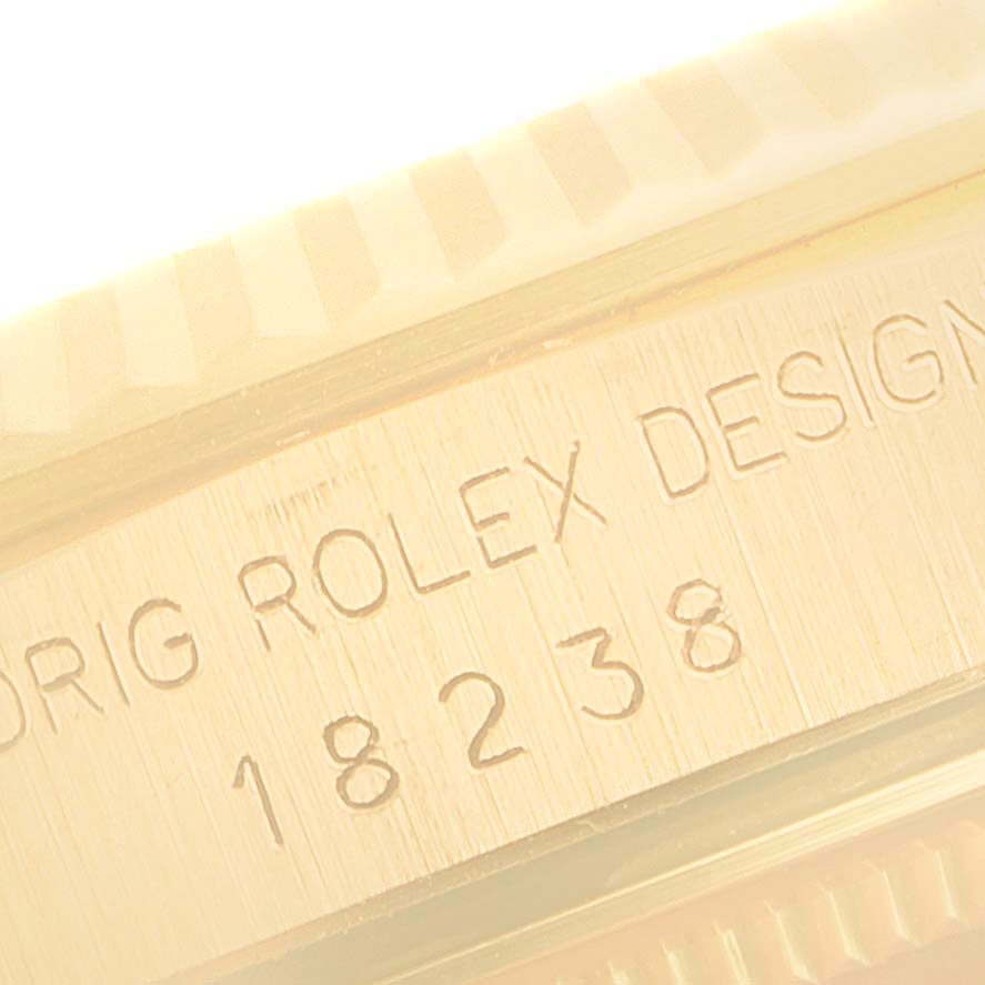 The image shows a close-up of the engraved model number "18238" on a Rolex President 18238 Men's Yellow Gold Champagne Dial 18238 Men's Yellow Gold Champagne Dial watch case.