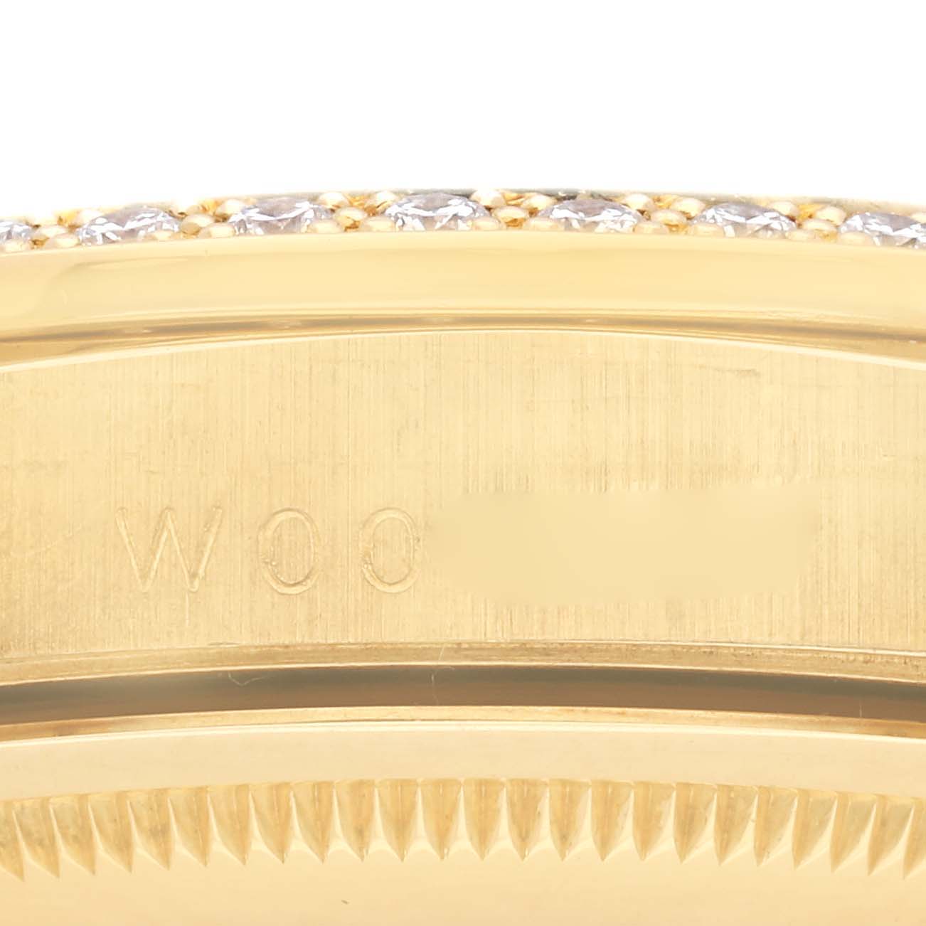 This close-up image shows the side profile of the bezel and case of a Rolex President 18388 Men's Yellow Gold Champagne Dial 18388 Men's Yellow Gold Champagne Dial watch, with visible engravings and diamonds.