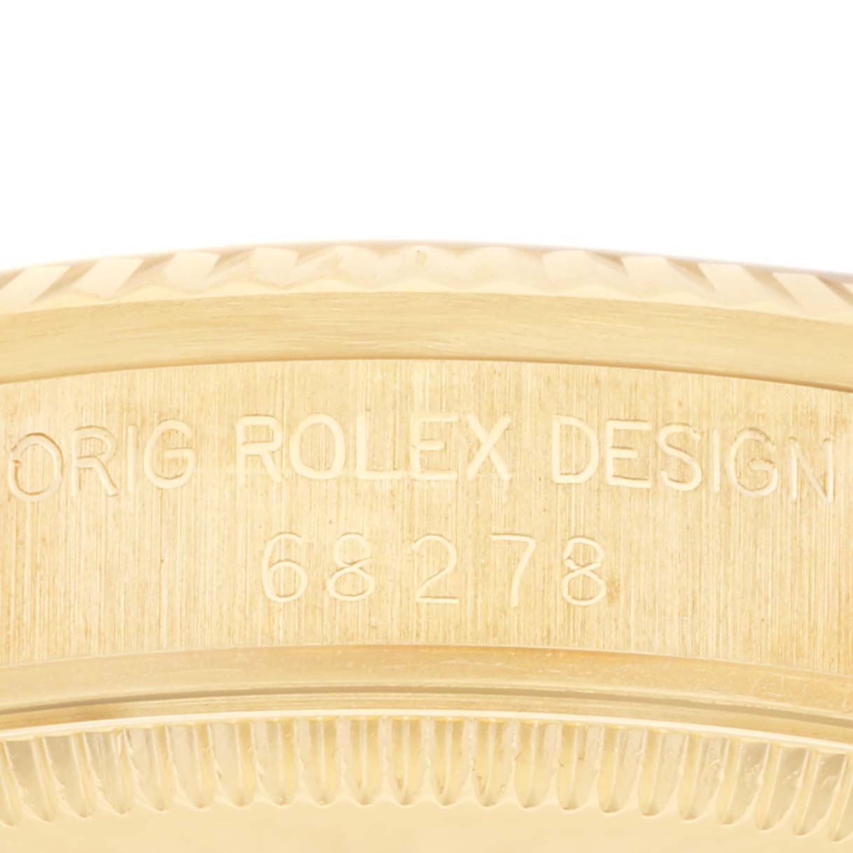This image shows a close-up of the case side of a Rolex President 68278 Women's Yellow Gold Champagne Dial 68278 Women's Yellow Gold Champagne Dial model, displaying the engraved design and model number 68278.