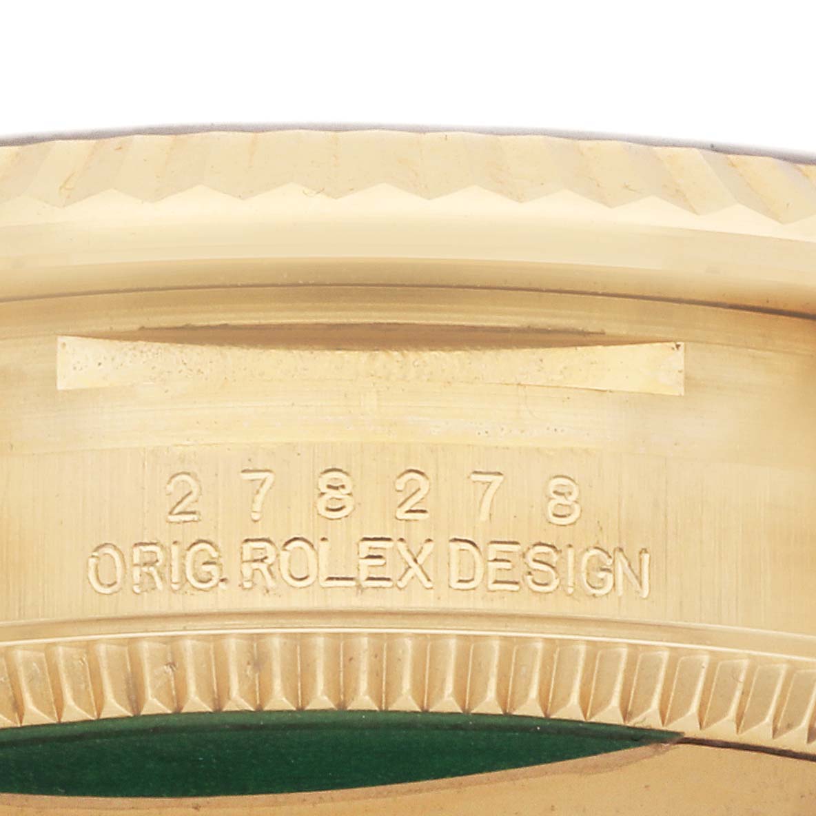 The image shows a close-up of the side engraving on the bezel of a Rolex President 278278 Women
s Yellow Gold Green Dial watch.