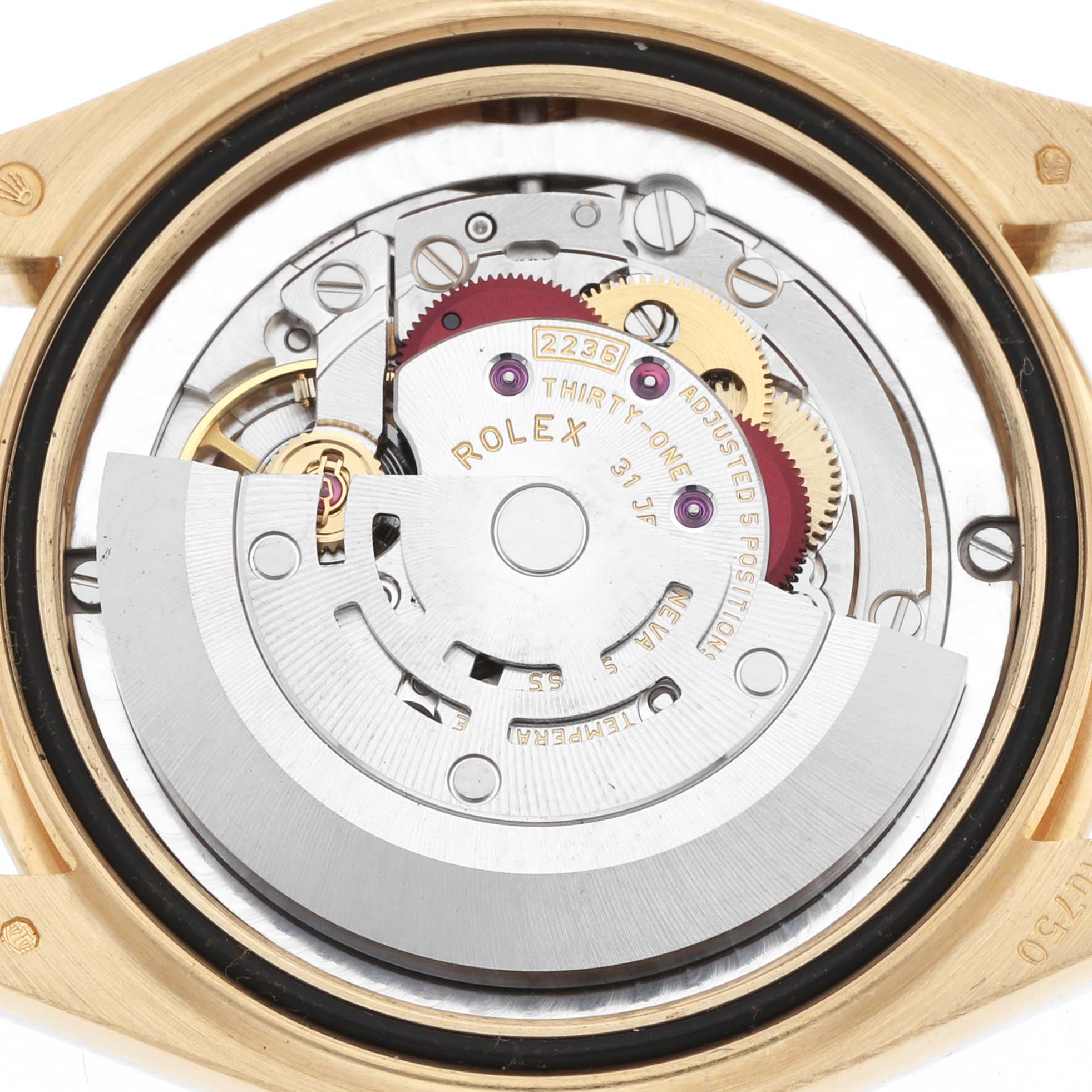 The image shows the Rolex President 278278 Women
s Yellow Gold Green Dial model
s movement, viewed from the back, highlighting the rotor and gears.