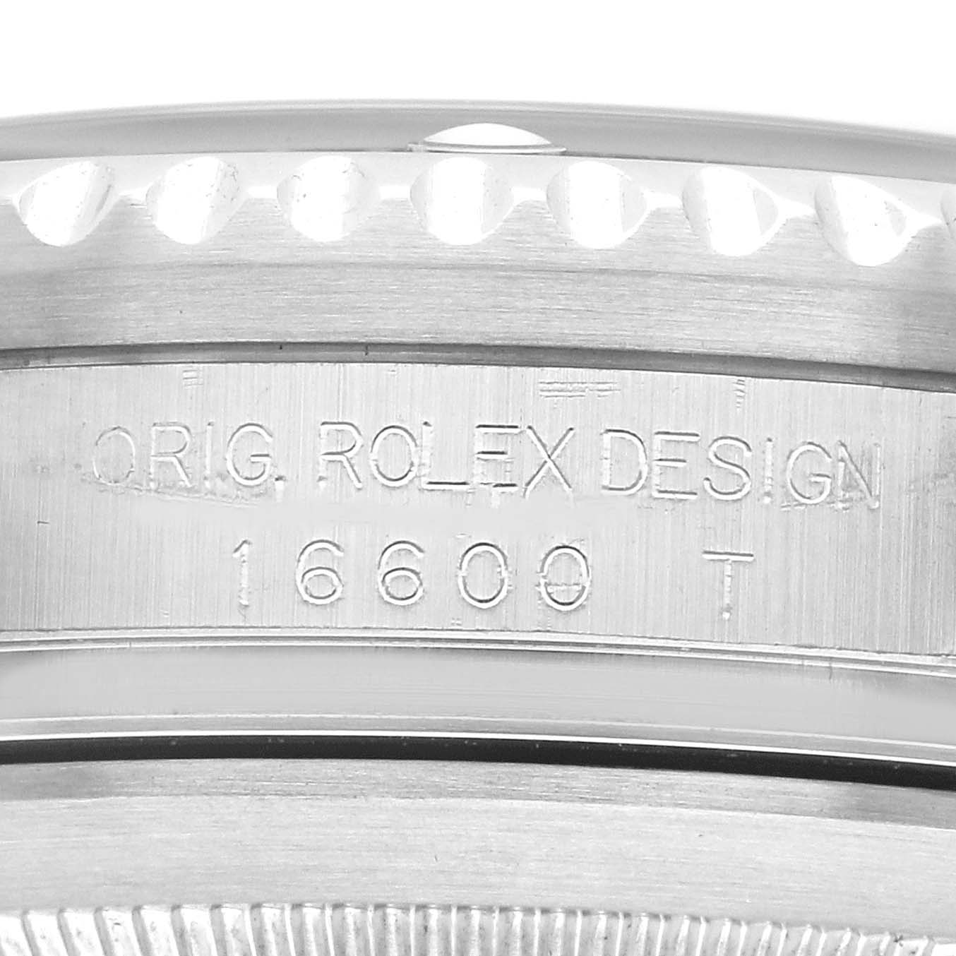 The image shows a close-up of the engraved case edge of a Rolex Sea-Dweller 16600 Men's Stainless Steel Black Dial, focusing on the design and model number.