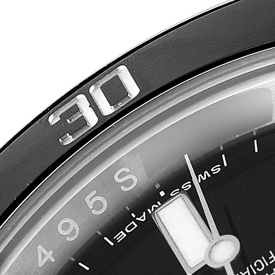 The image shows a close-up of the bezel and dial of a Rolex Submariner 114060 Men
s Stainless Steel Black Dial 114060 Men
s Stainless Steel Black Dial watch, highlighting the 30-minute marker.