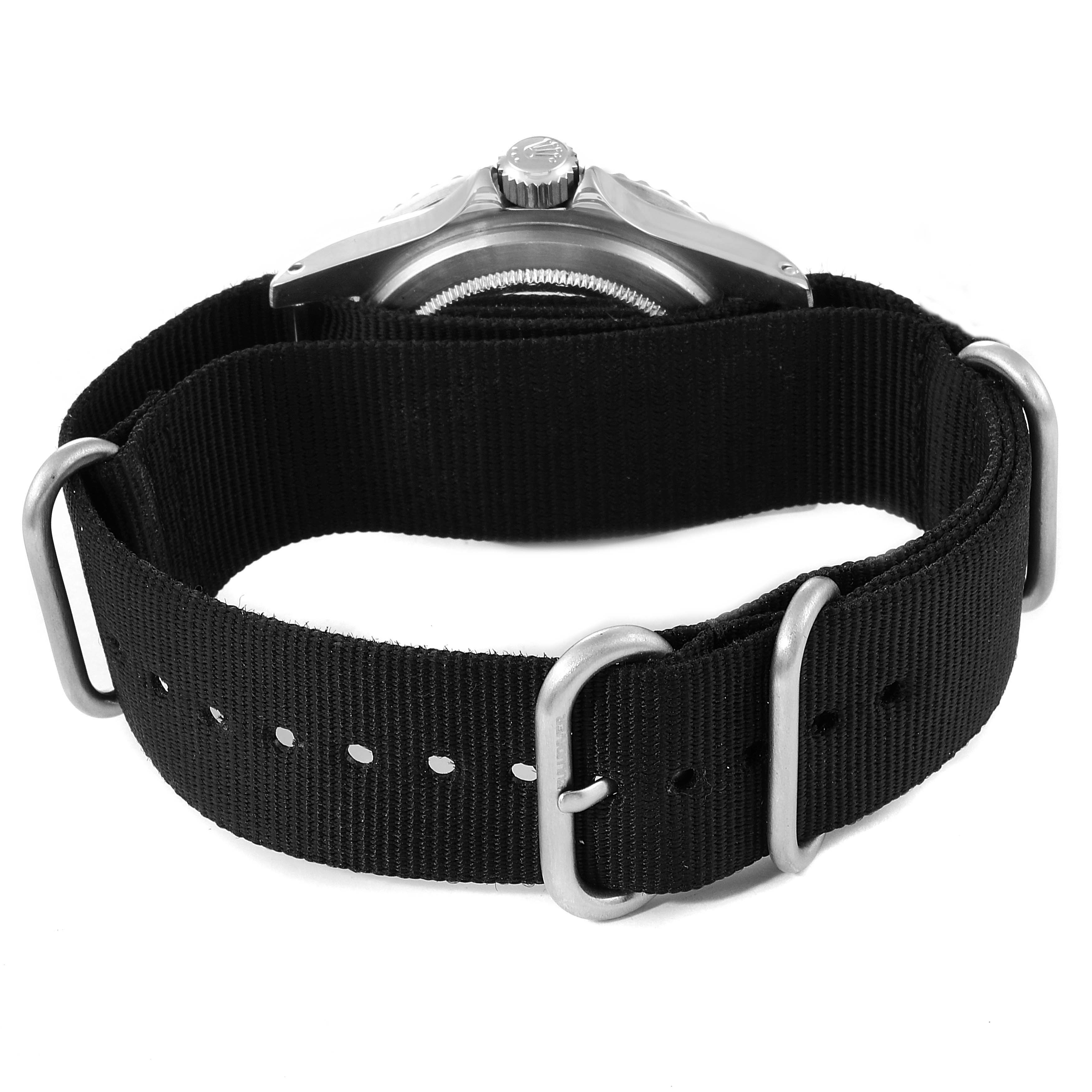 This image shows the back of the Rolex Vintage Collection 5513 Men
s Stainless Steel Black Dial 5513 Men
s Stainless Steel Black Dial model watch with its black fabric strap and metal hardware.