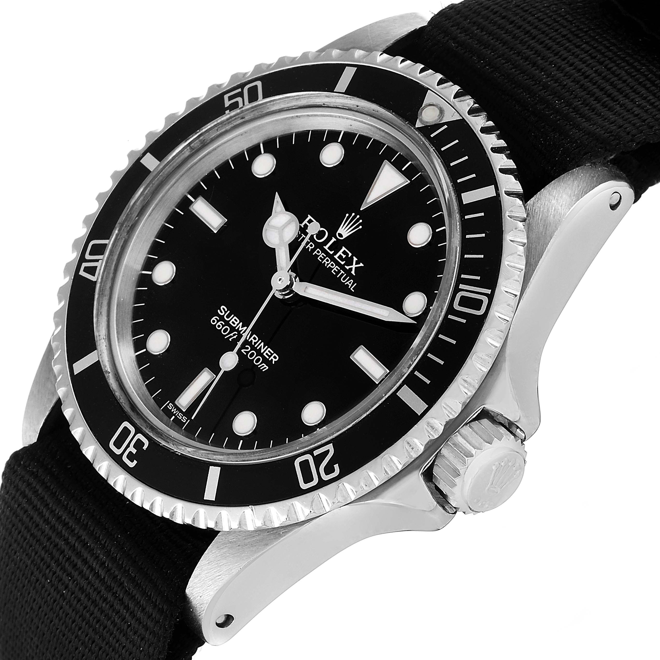 The image shows a close-up of the Rolex Vintage Collection 5513 Men
s Stainless Steel Black Dial 5513 Men
s Stainless Steel Black Dial Submariner watch, highlighting its bezel, crown, dial, and part of the strap.