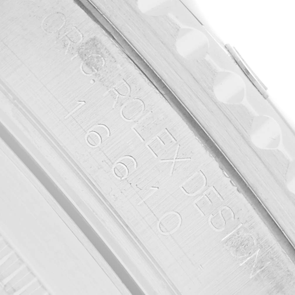 The image shows a close-up of the Rolex Submariner 16610 Men's Stainless Steel Black Dial's inner bezel with engravings visible.