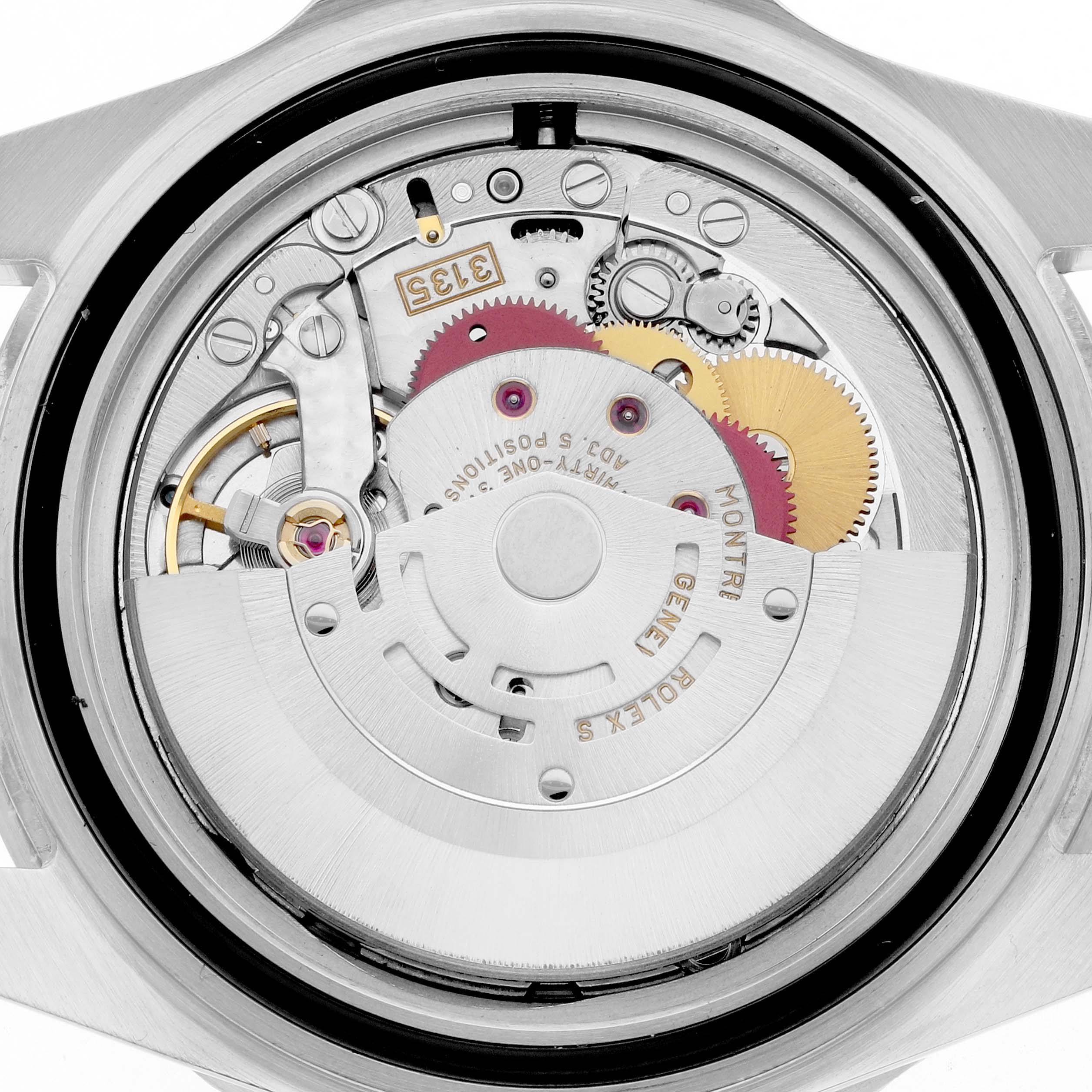 The image shows the movement of a Rolex Submariner 16610 Men's Stainless Steel Black Dial, viewed from the back, highlighting gears and the rotor.