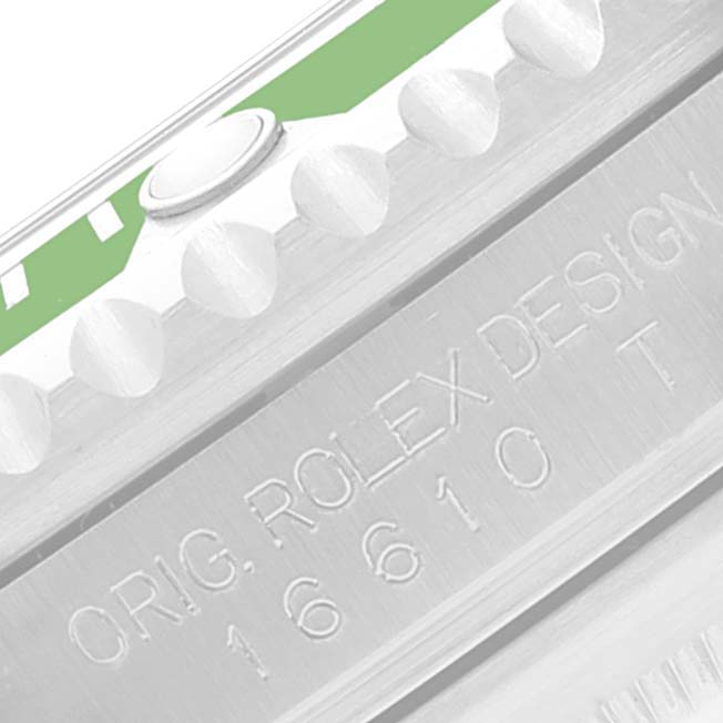 This close-up image shows the model number and part of the bezel of the Rolex Submariner 16610LV Men's Stainless Steel Black Dial 16610LV Men's Stainless Steel Black Dial watch.