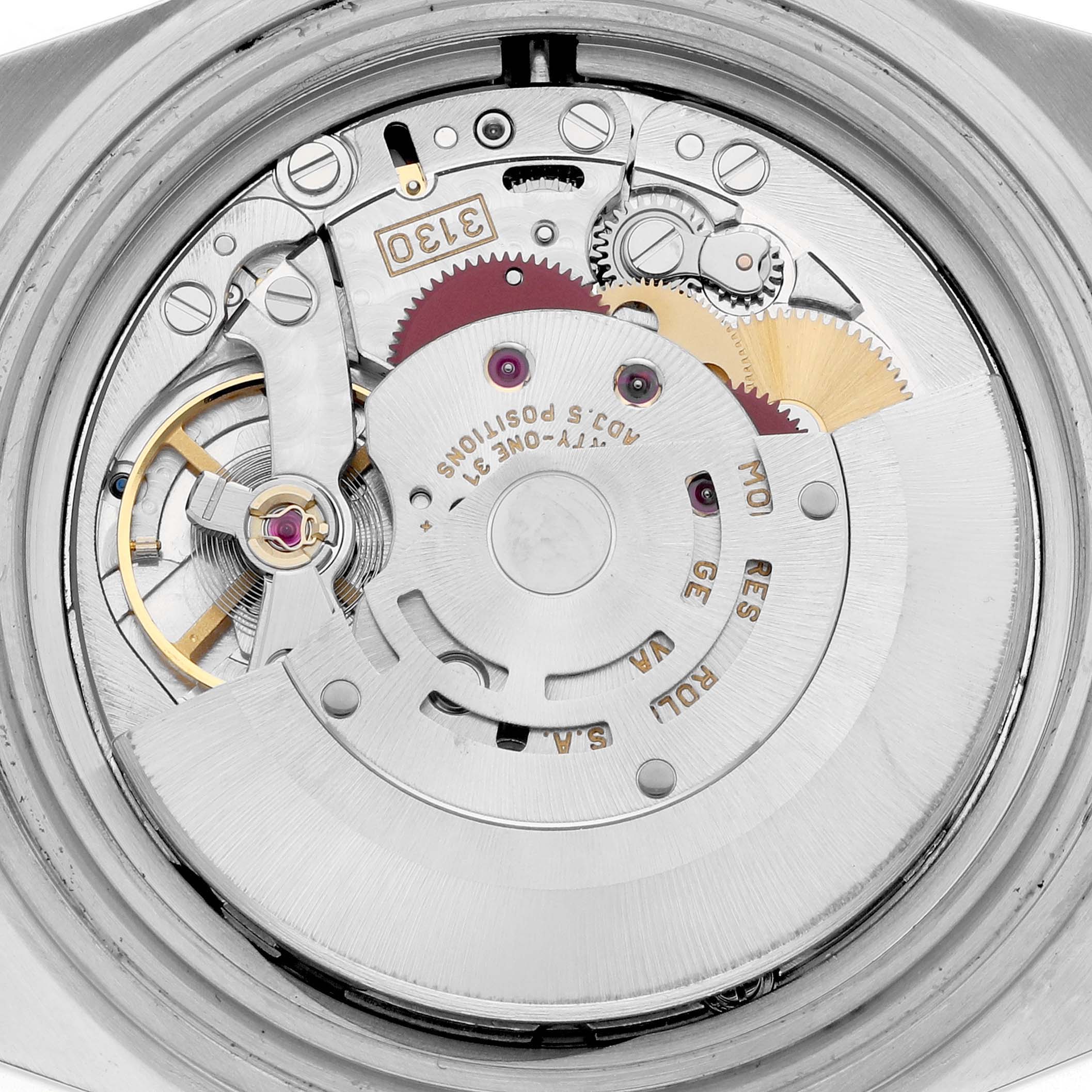 The image shows the intricate movement and internal mechanism of a Rolex Submariner 14060M Men
s Stainless Steel Black Dial watch from a rear angle.